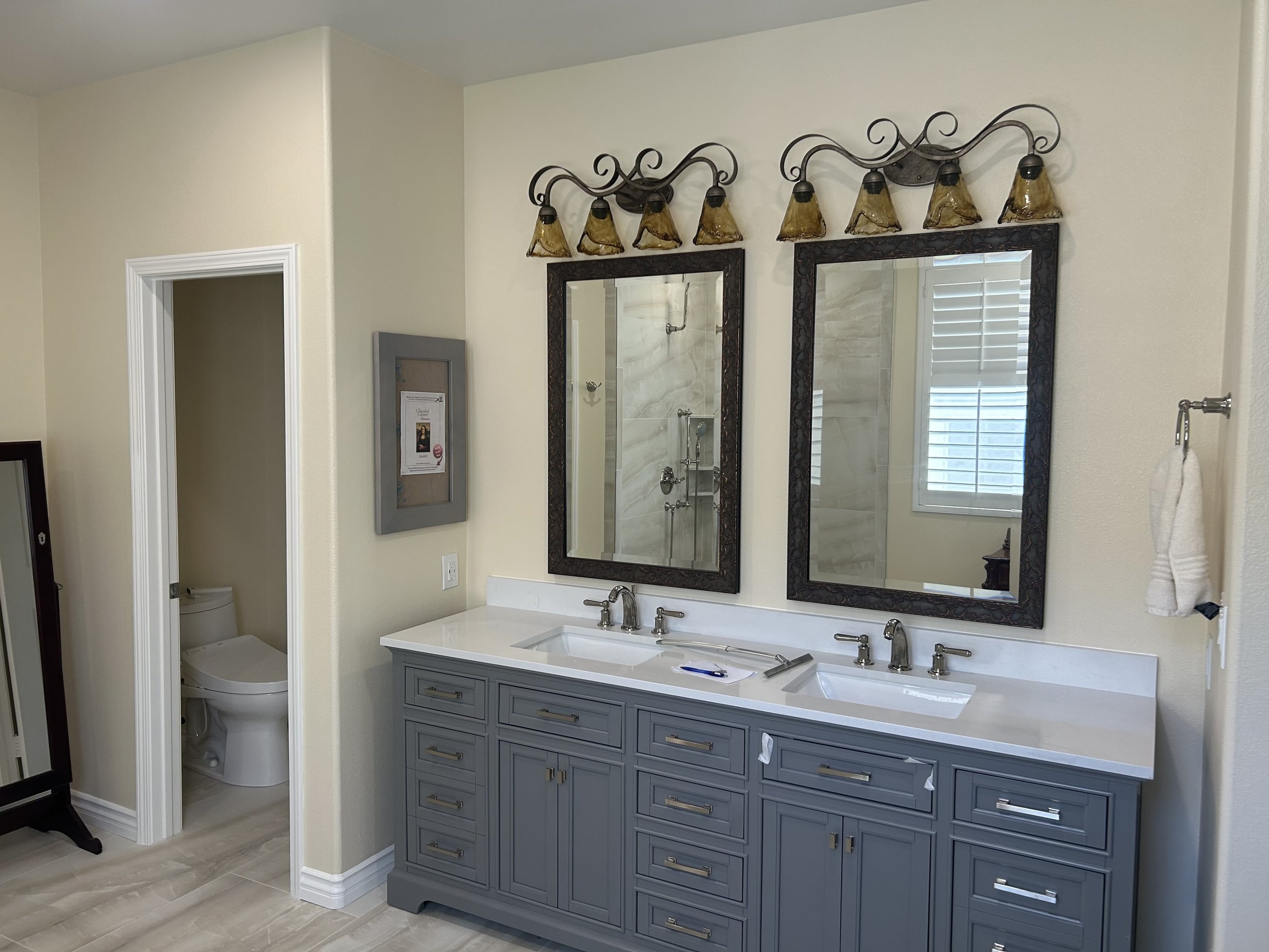 This home was filled with a lot of dark wood furniture. As part of the bathroom remodel design process it was suggested the client select a transitional vanity