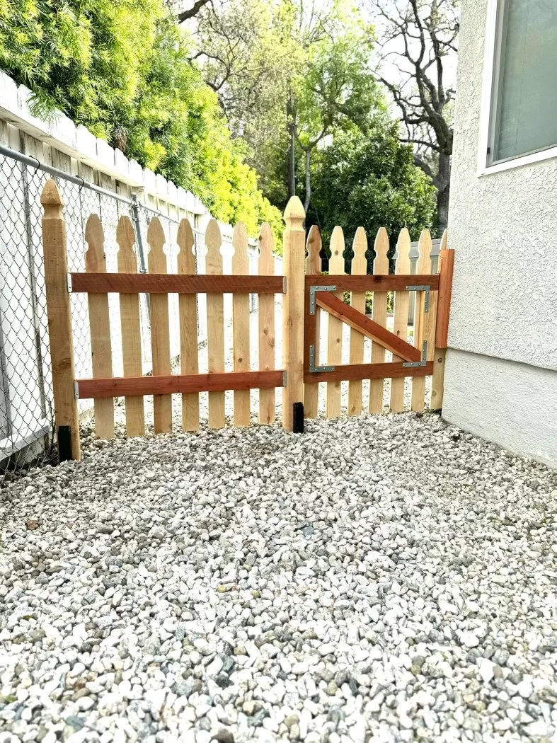 Fence and Gate in the Gothic style. This was intended to keep a small dog out of their side yard