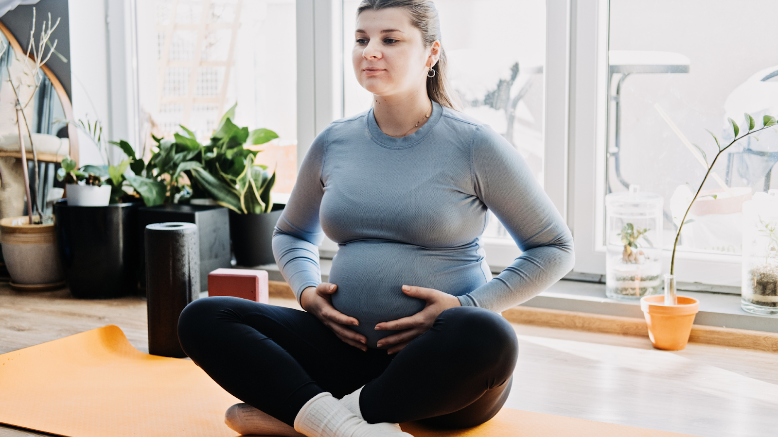 Pregnant person practicing prenatal pelvic floor therapy