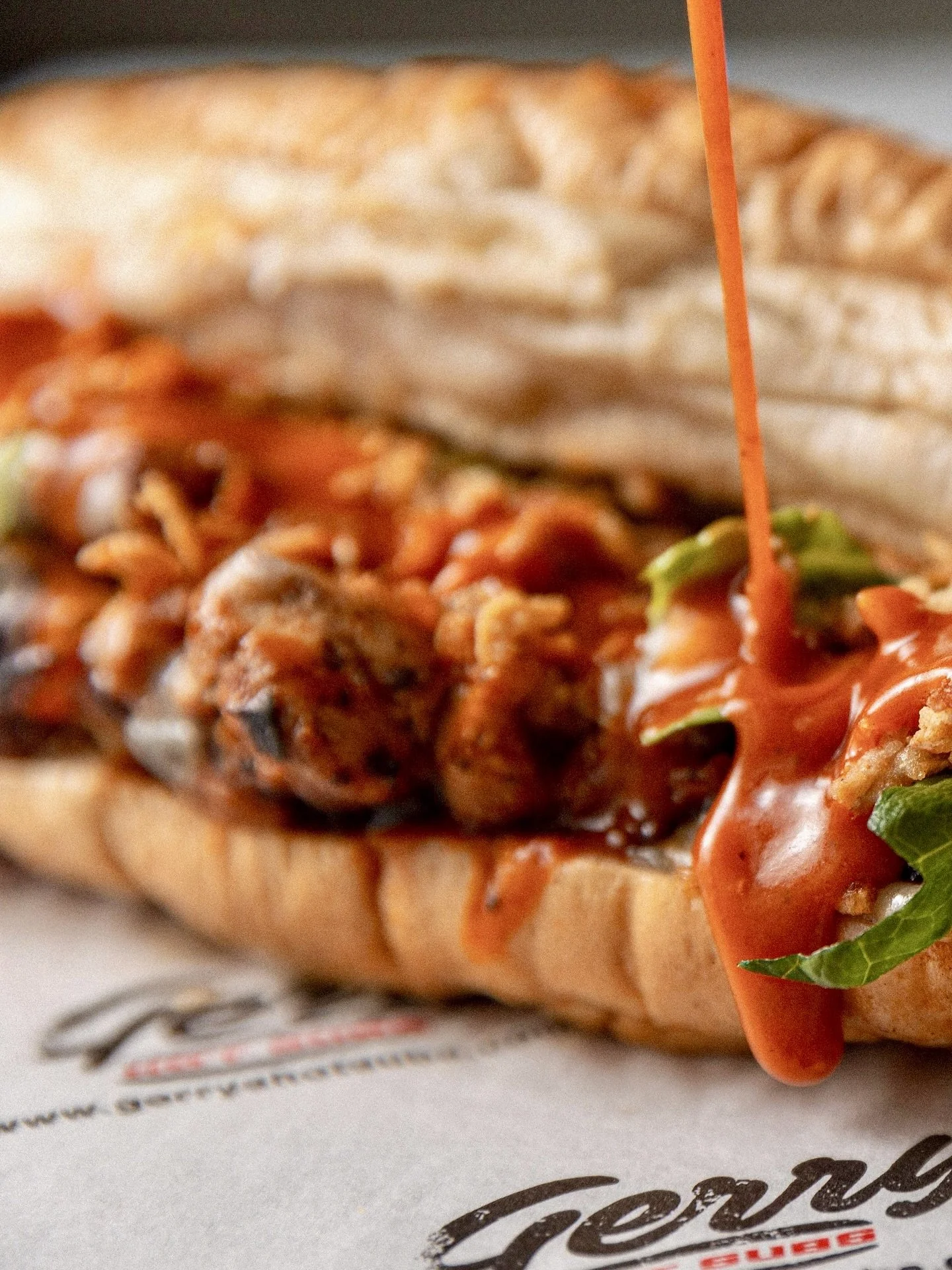 Drenched, dressed, and dangerously delicious. Buffalo chicken, Gerry&rsquo;s style.
 
Juicy marinated chicken strips, Emmental cheese, lettuce, Gerry&rsquo;s Hot Sauce, blue cheese dressing, and of course, crispy onions. 🔥