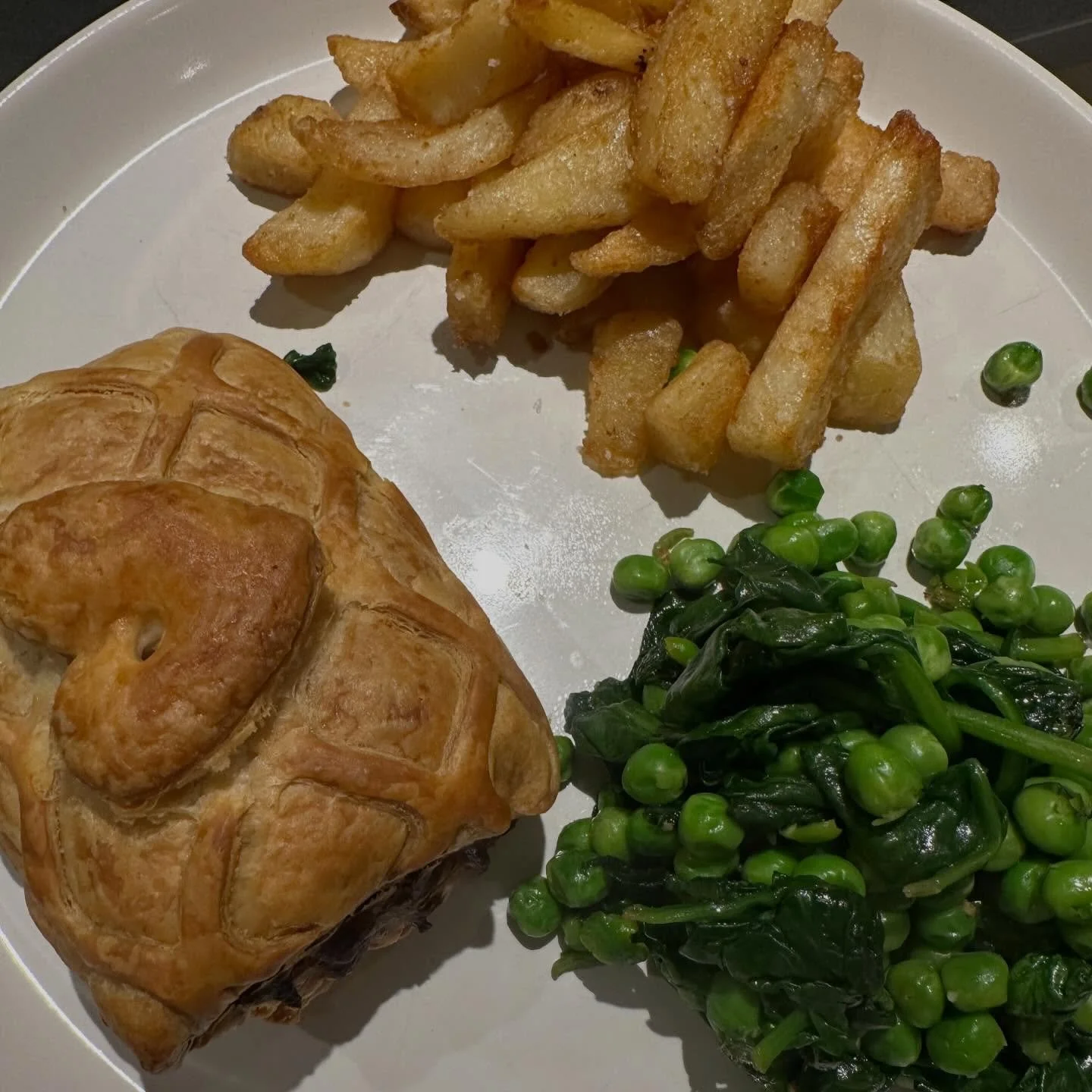 Early Valentine&rsquo;s Day meal. Starter, main, two sided, dessert and a bottle of fizz for &pound;12. We got the vegan Brie hearts with sweet chilli sauce, vegetable Wellington, triple cooked chips and strawberries with chocolate sauce🍫 the spinac