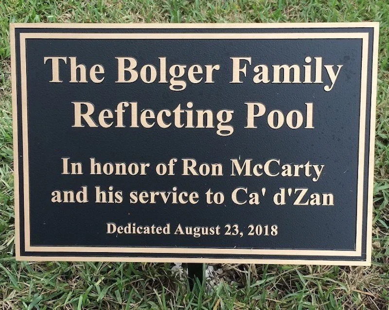 A memorable sign saying THE BOLGER FAMILY REFLECTING POOL