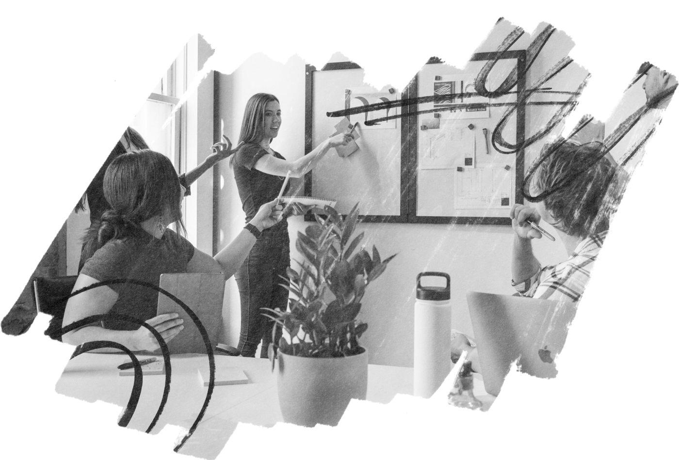 Team leaders collaborating at a whiteboard to clarify priorities and next steps