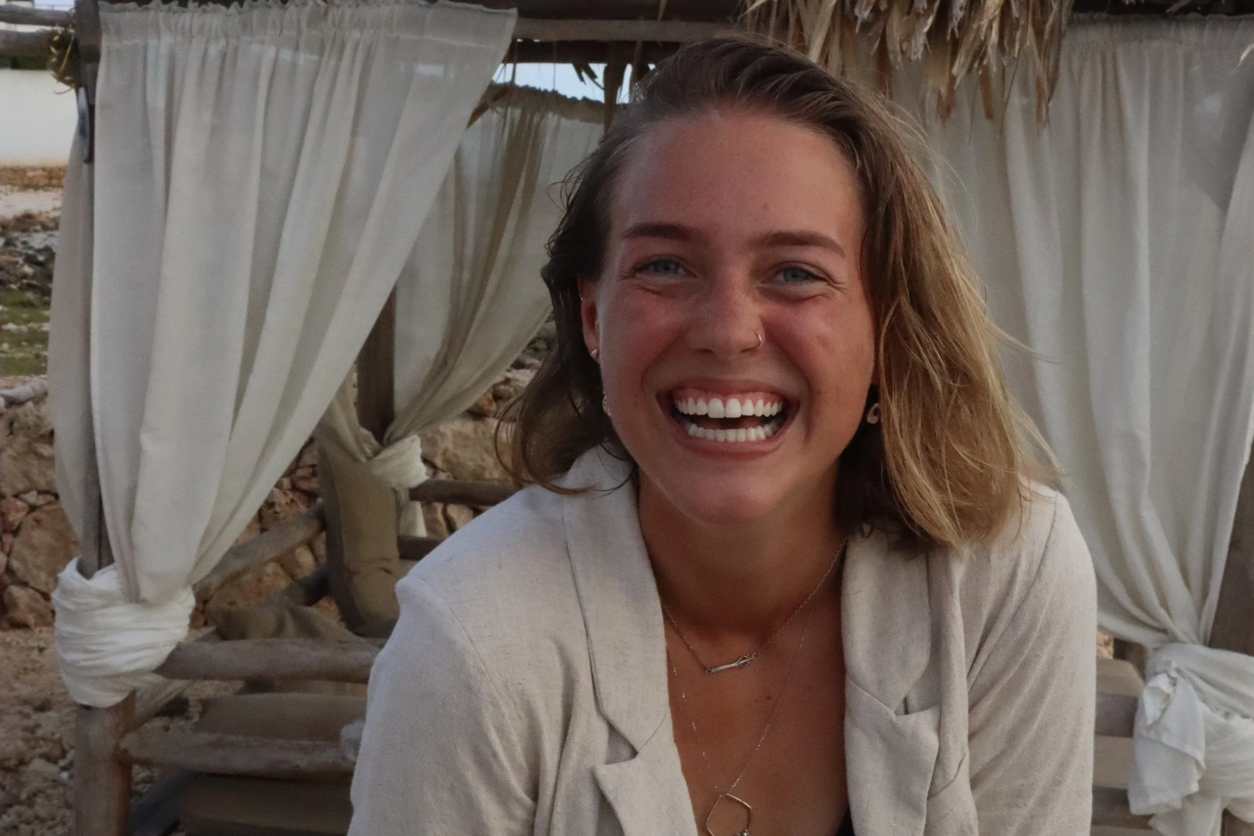 Girl smiling at the camera.