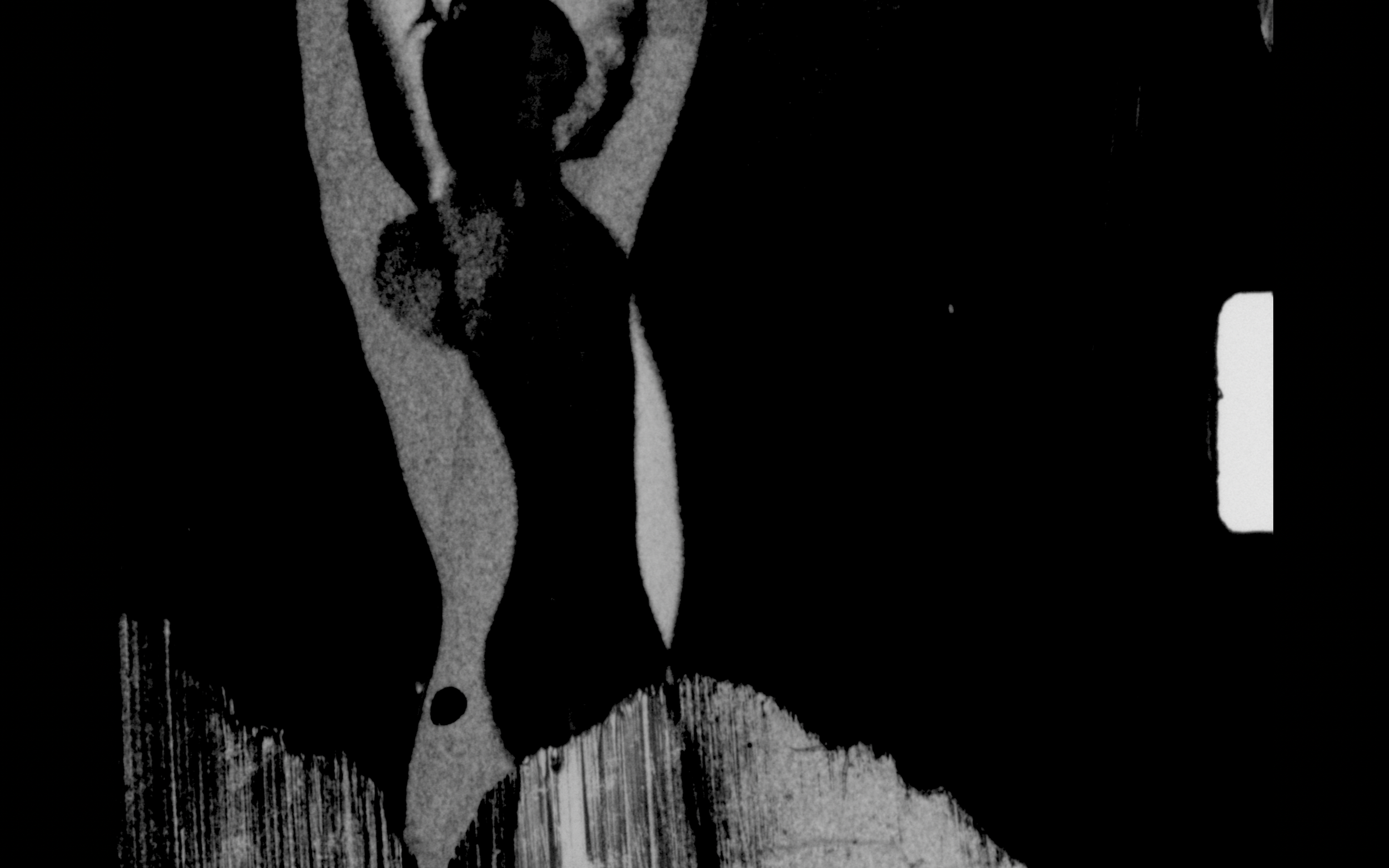 An abstract Black and while picture of Mathilde Brok Brandi from 8mm footage that has been painted on.