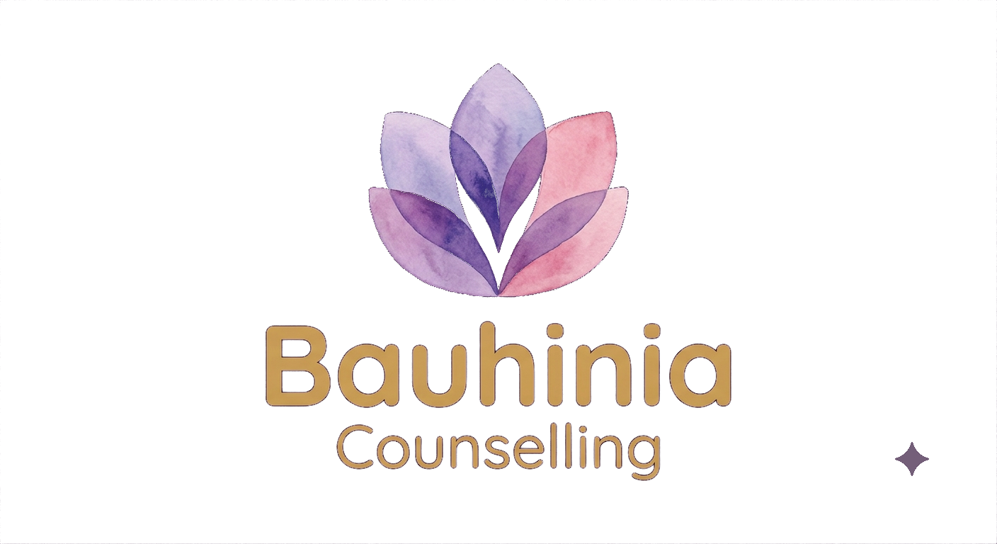 A logo for Bauhinia Counselling featuring a stylized lavender and pink lotus flower and the words 'Bauhiniia Counselling' in gold and light brown text.