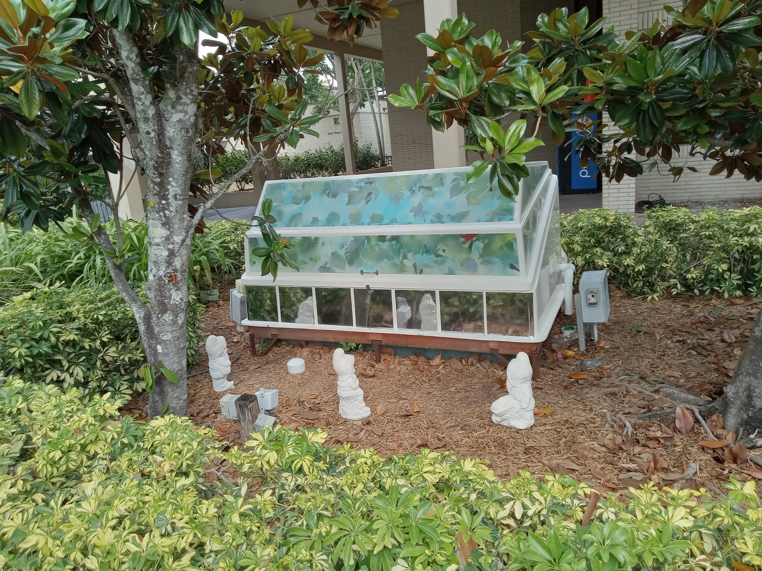 Roxanne Guerra: Koi Pond Pump Housing project, Spray paint; garden gnomes; reflective foil, 2023.