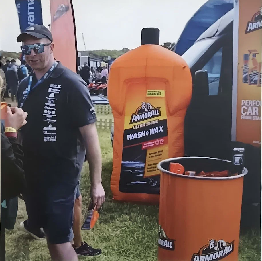 Giant inflatable Armor All Wash & Wax bottle displayed at an outdoor brand activation