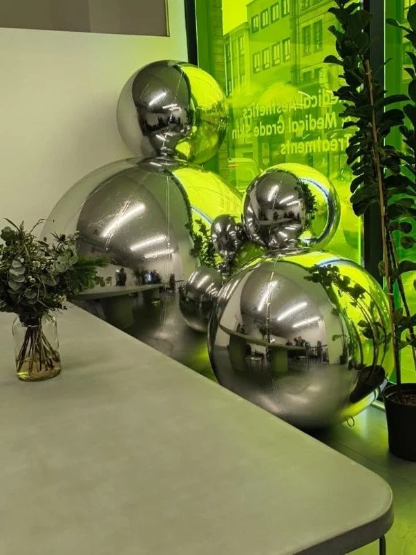 Mirror Balls for Alien Christmas Window Display