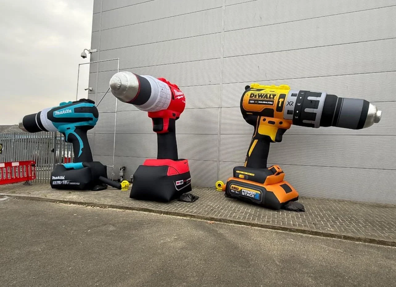 Bespoke promotional inflatables designed as giant branded power tool replicas for marketing events and exhibitions