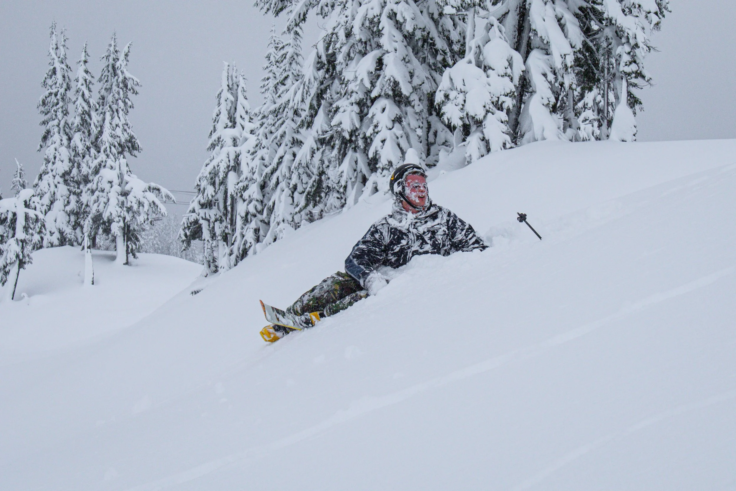 Mosi Slotten accepts a face full of snow after losing a ski mid-jump at Mount Baker Ski Area on Tuesday, Nov. 15, 2025, in Deming, Wash. The tough crash marked the last jump of the day.
