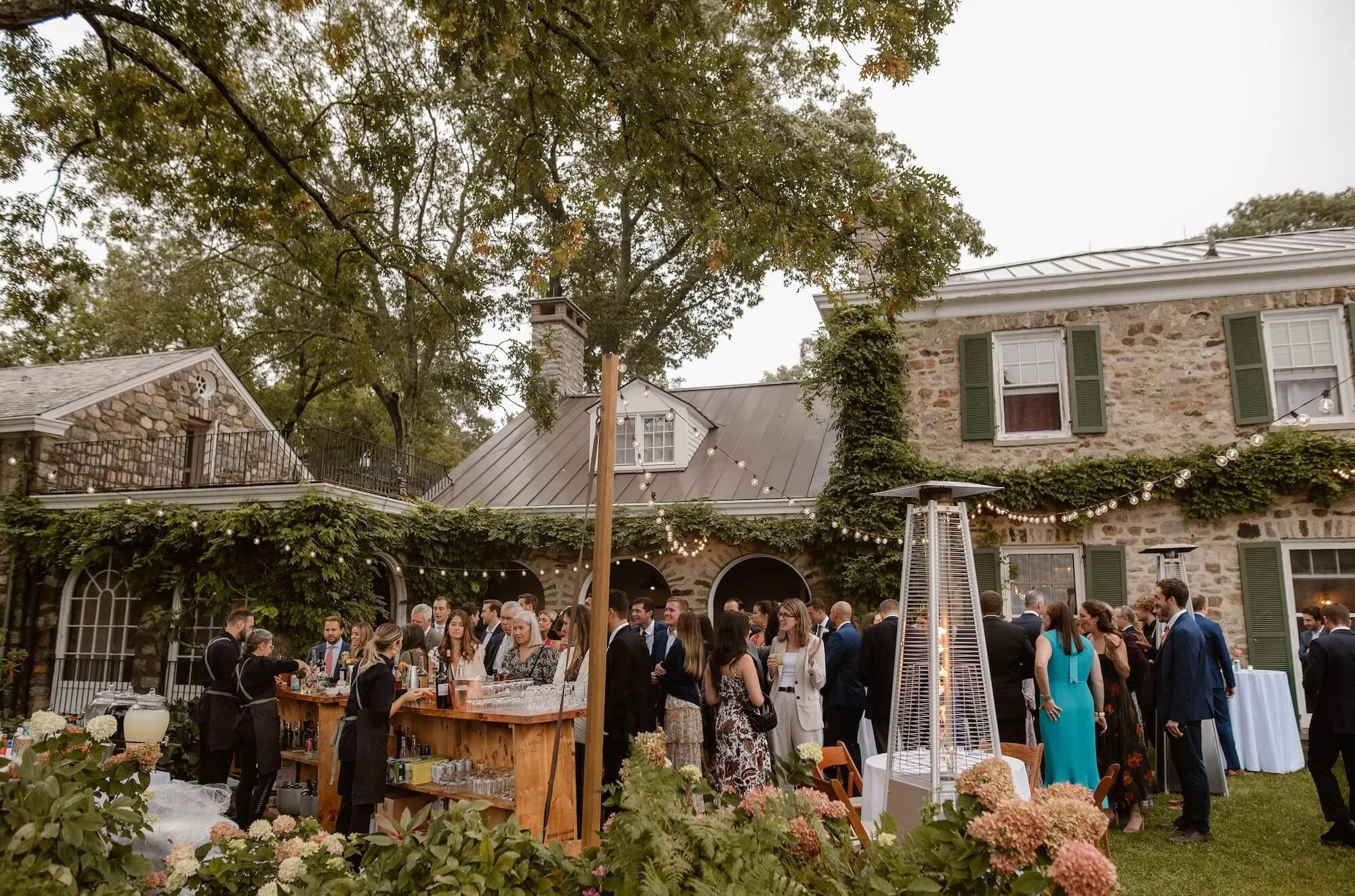 Wedding guests enjoying outside bar at Glynwood Estate