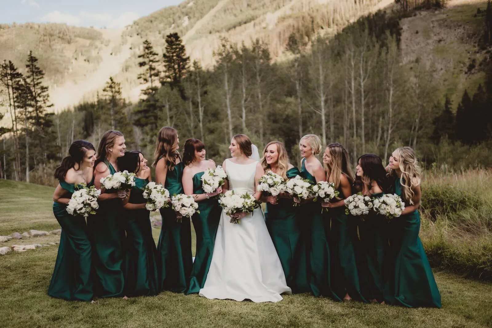 Bridal Party Outdoors With Mountain Backdrop at Colorado Destination Wedding