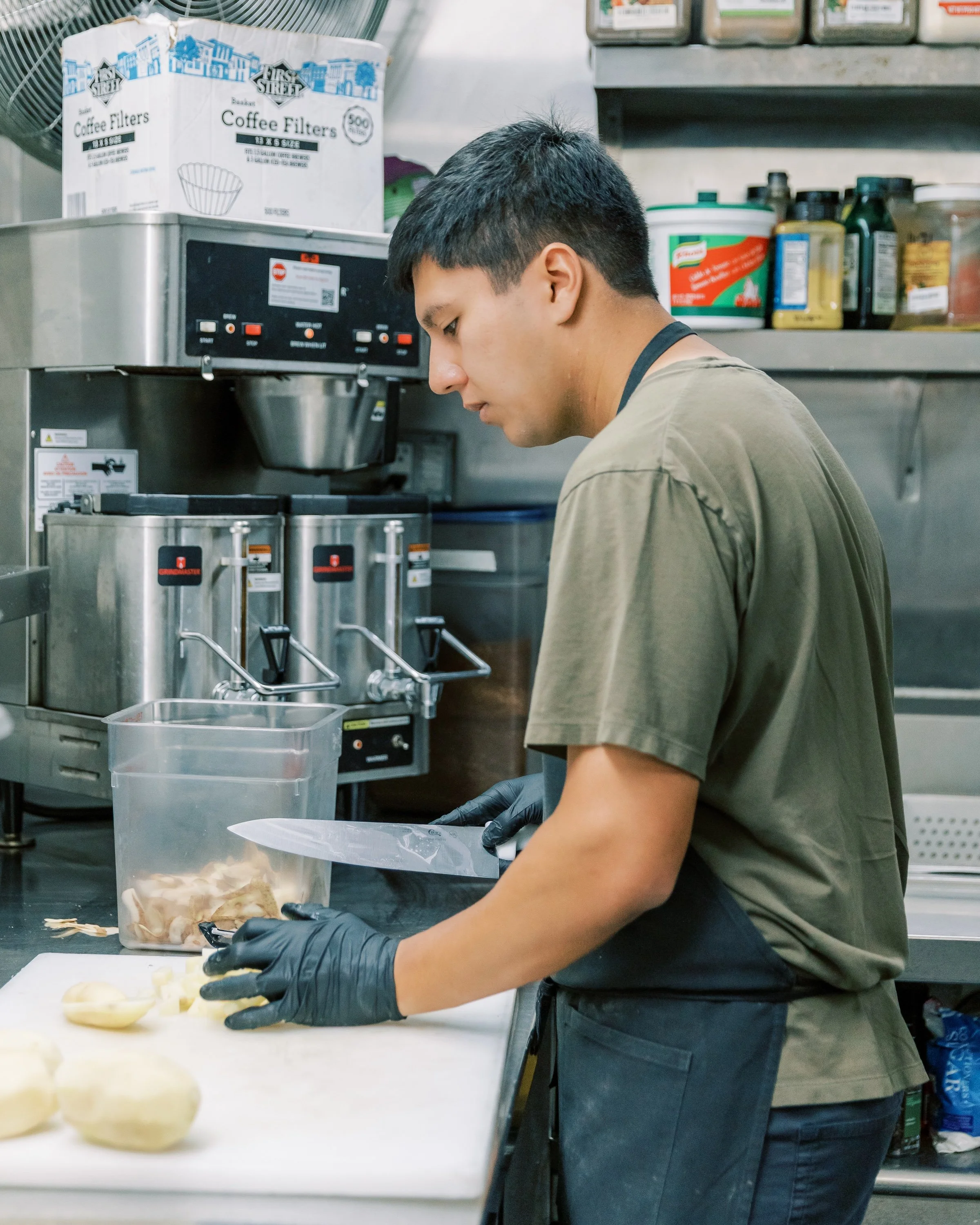 USHS Volunteer works in the kitchen at the Union Station Homeless Services Adult Center.