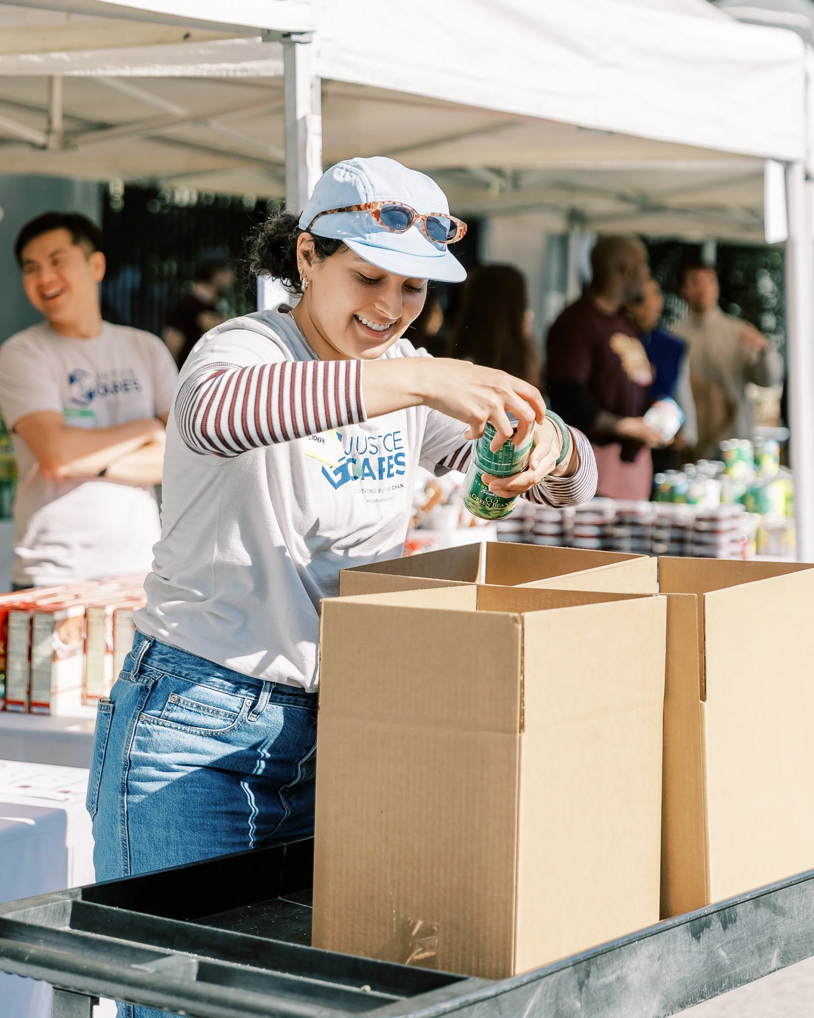 USHS Volunteer prepares Thanksgiving meal kits to distribute to the community during Dinner in the Park