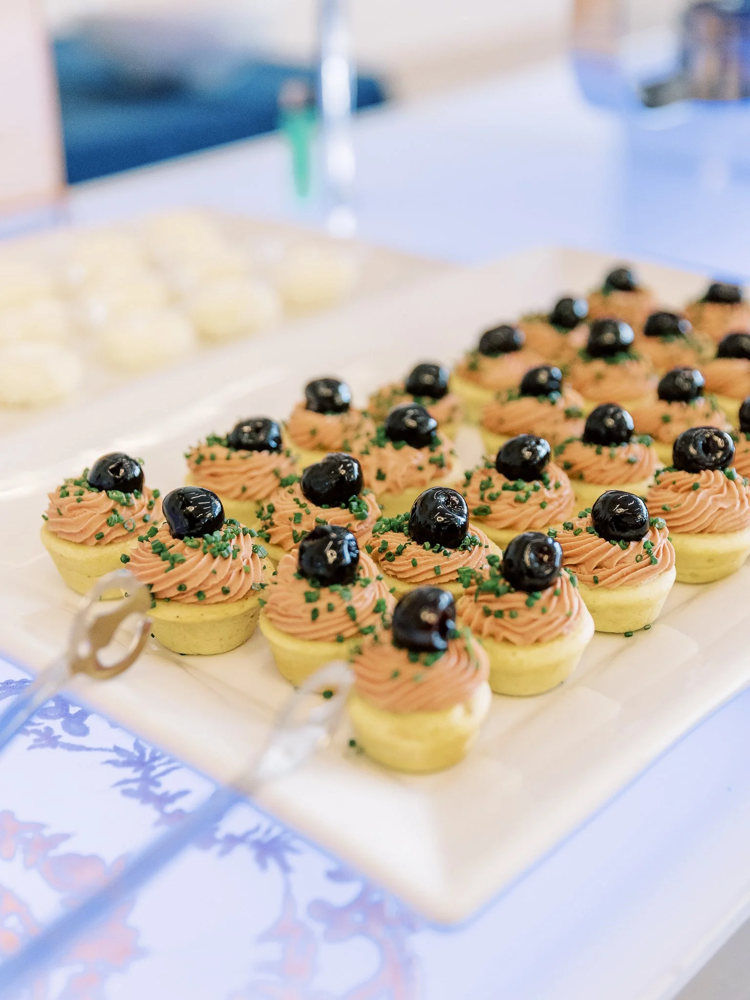 Savory mouse atop corn bread and topped with black olives at Brunch for the Station
