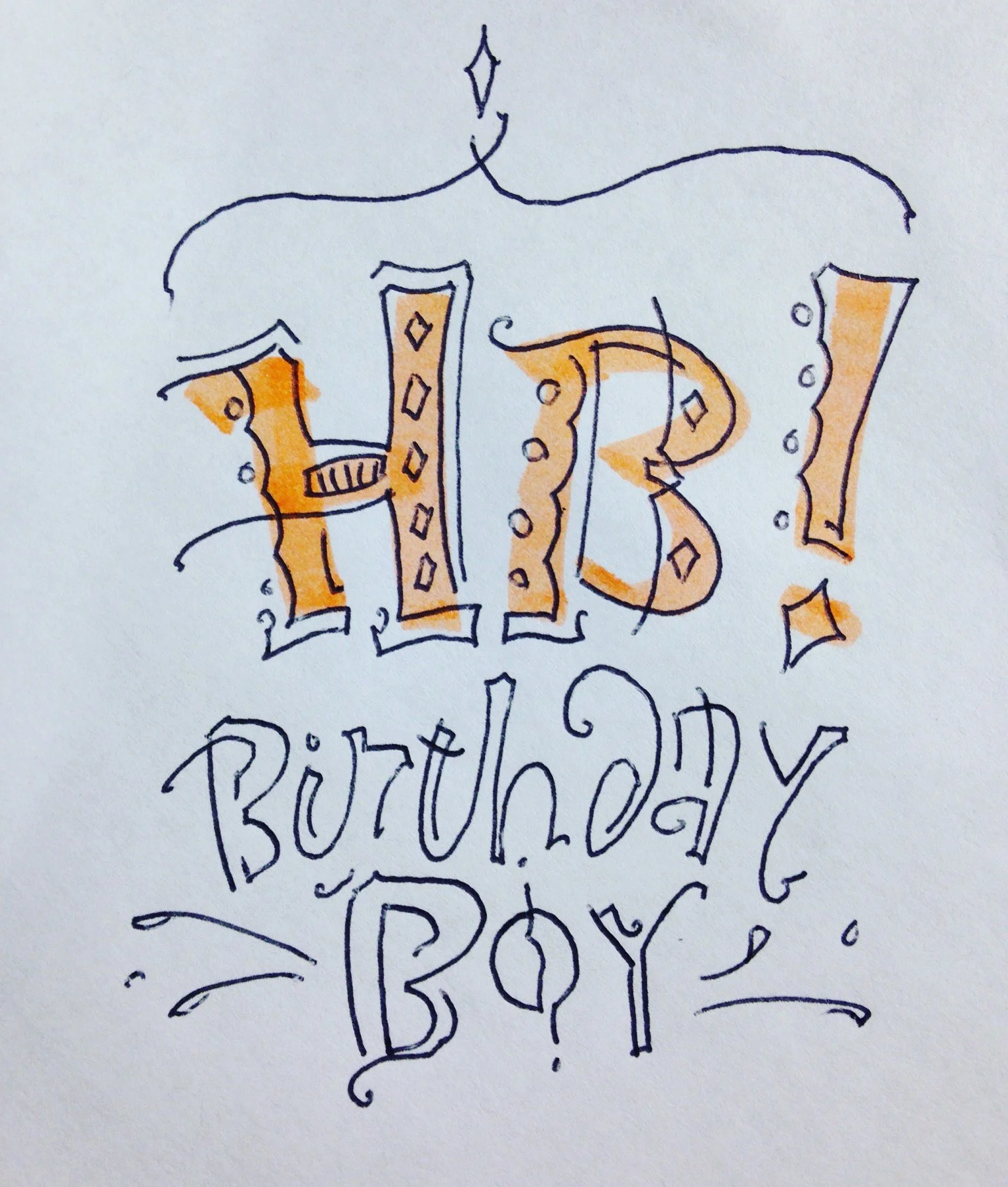 Hand-lettered text "HB! Birthday Boy" with decorative elements, in a mix of bold and cursive styles, using black and orange ink.