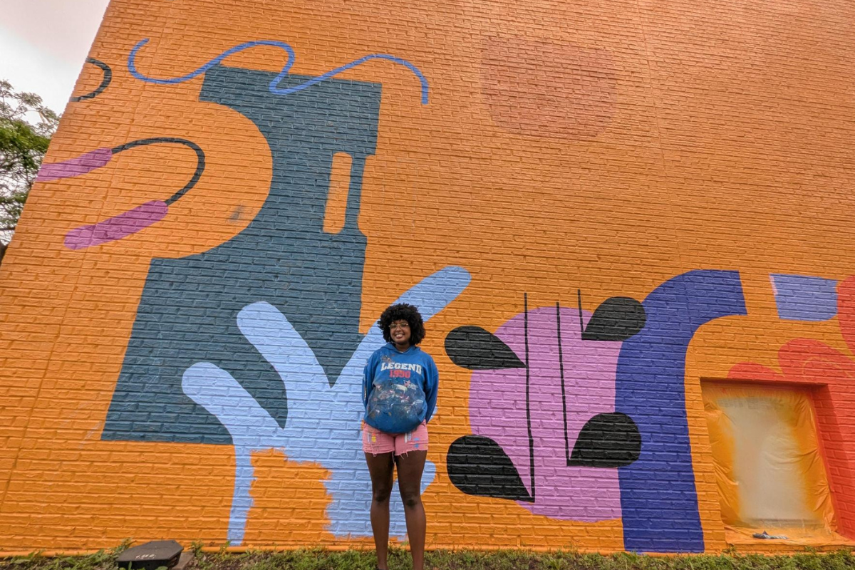 Midtown Murals Hibaaq with Mural.png