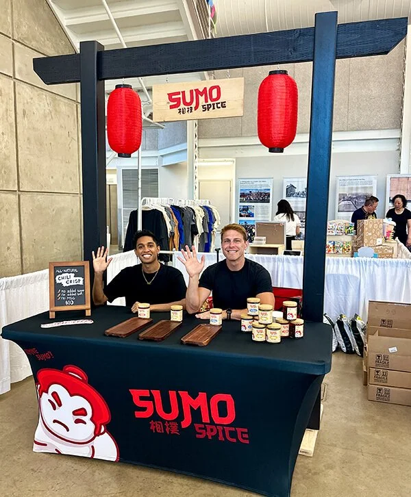 Nathan and Ashan, co-founders of Sumo Spice, at the Utah Asian Festival booth for their healthy chili crisp made with avocado oil and no seed oils.