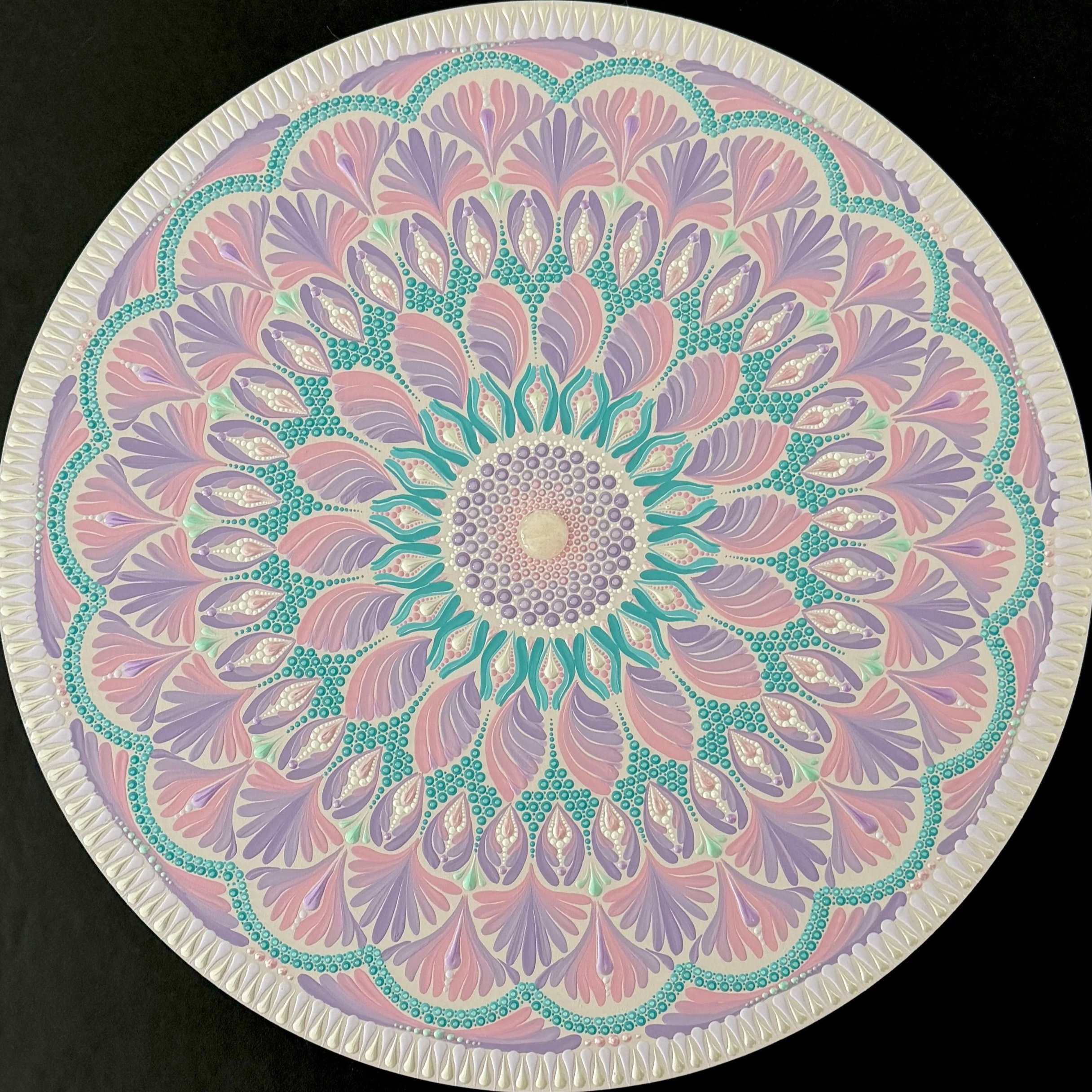 A finished large free flow mandala in soft pinks, purples and turquoise