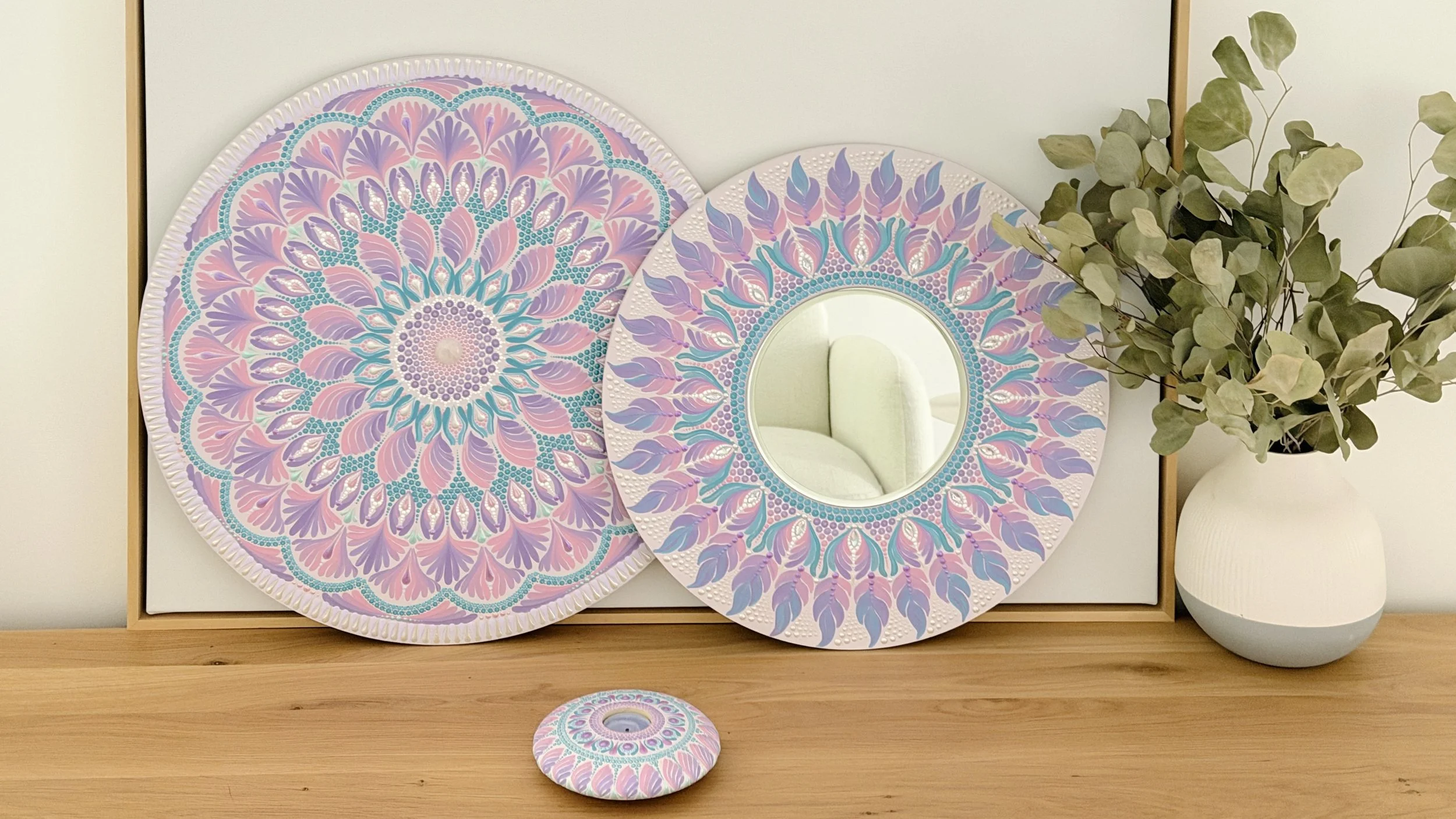 A mandala, a mirror, and a tea light holder together as a matching set in one palette
