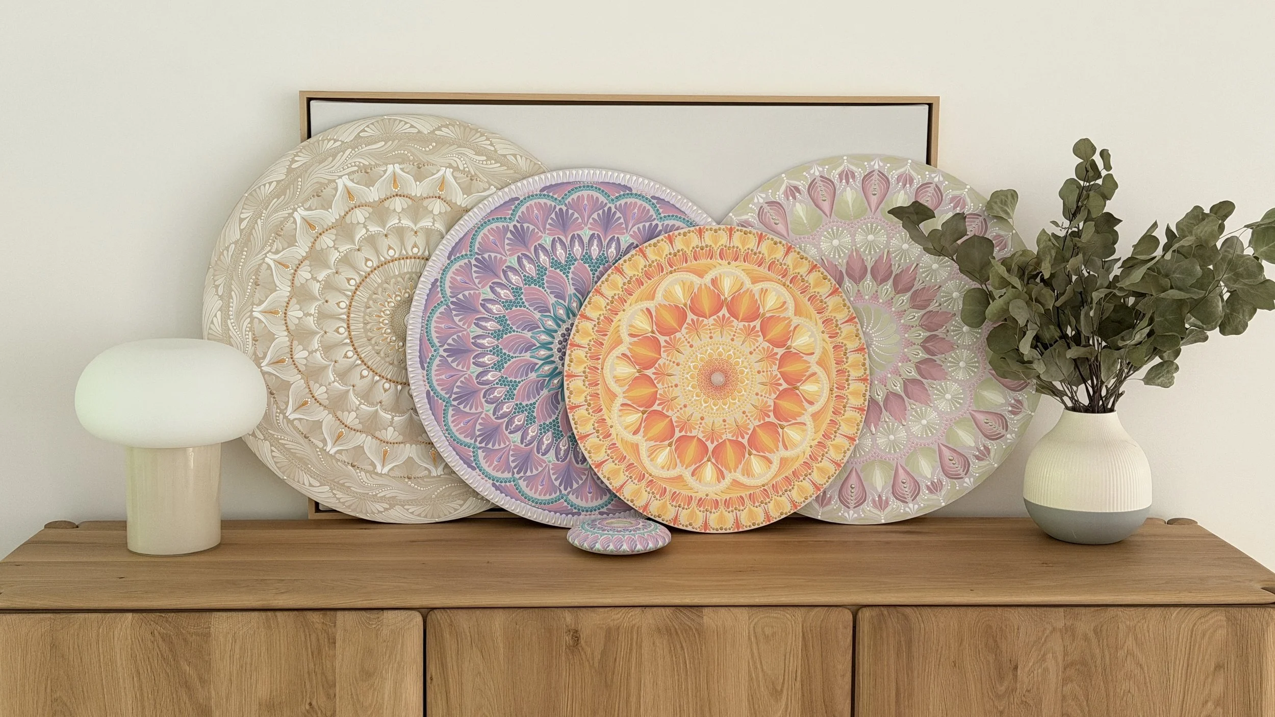 A large hand-painted brushstroke mandala