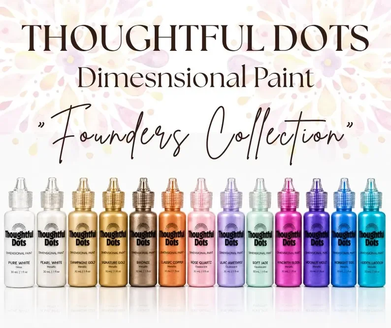 Display of Thoughtful Dots dimensional paint bottles in various colors with labels and a pastel floral background.