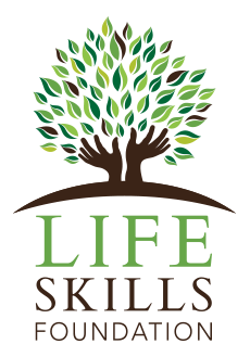 Logo of a tree with green leaves and brown trunk, with text 'LIFE SKILLS FOUNDATION' beneath it.