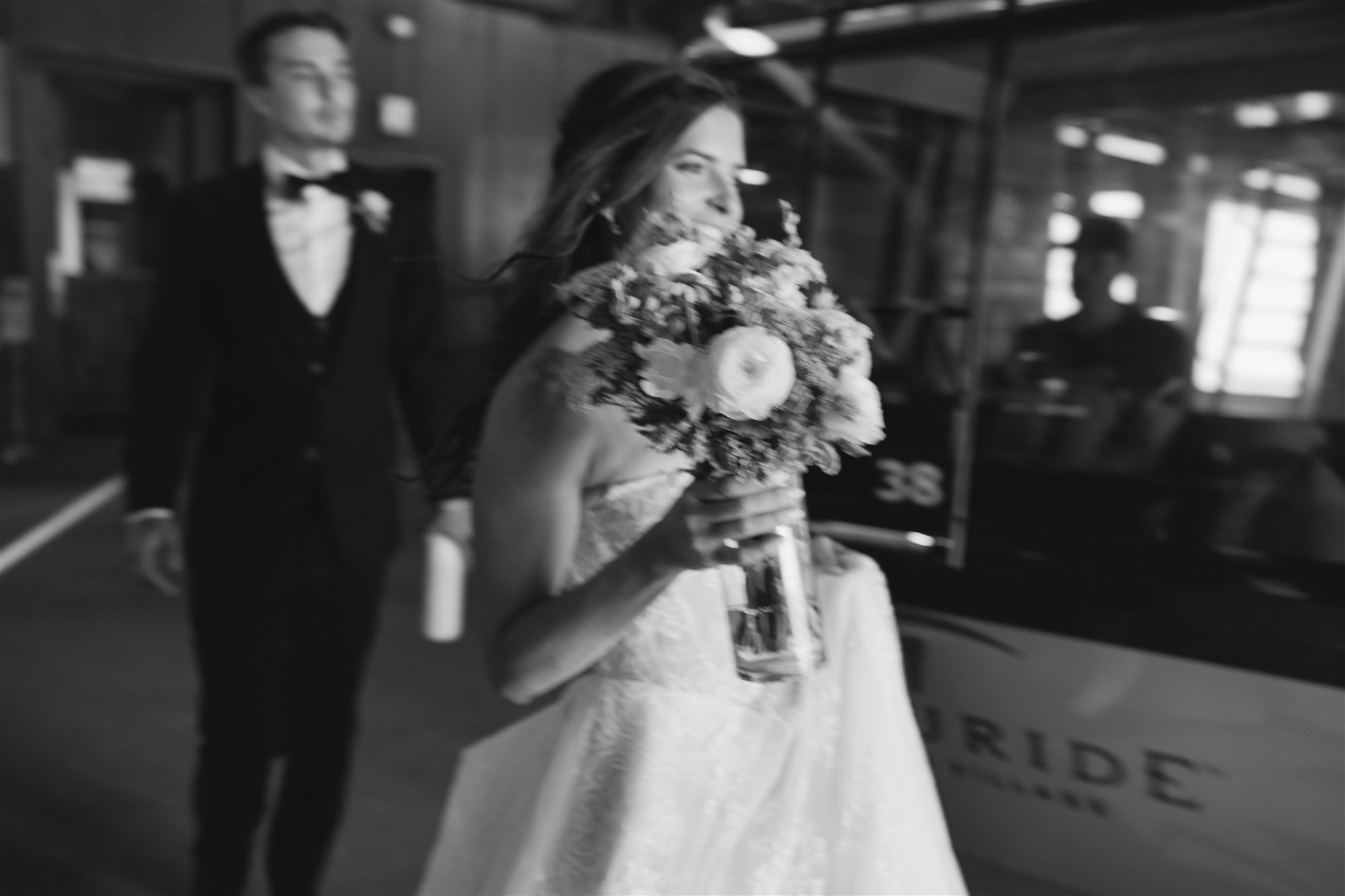 bride and groom walking away from the Telluride gondola to their ceremony