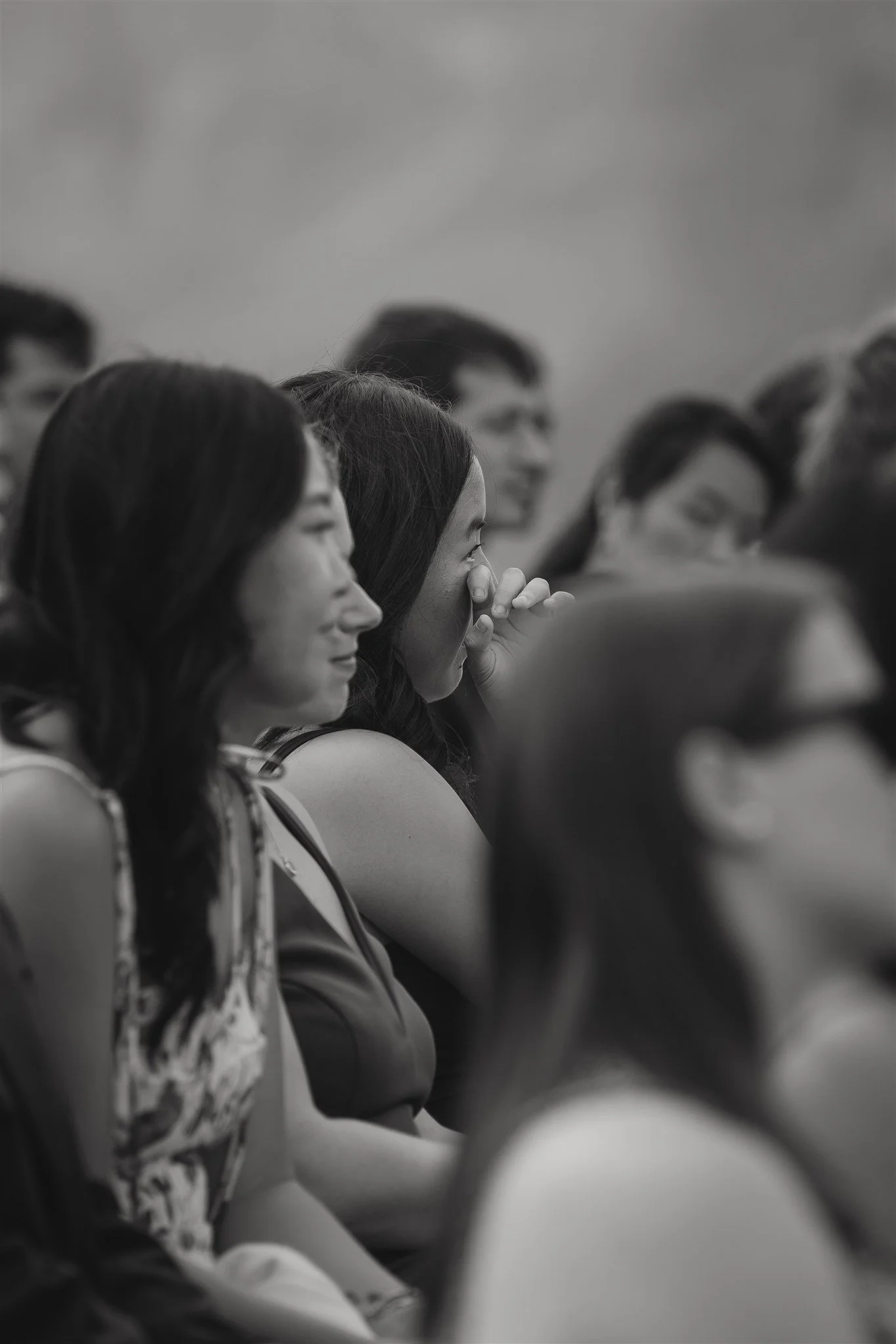 guests wipes away a tear from her face during the ceremony