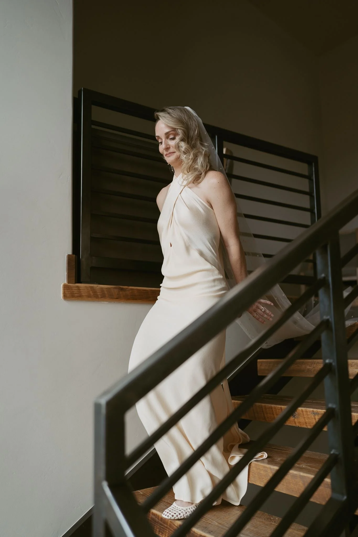 bride walks down the stairs