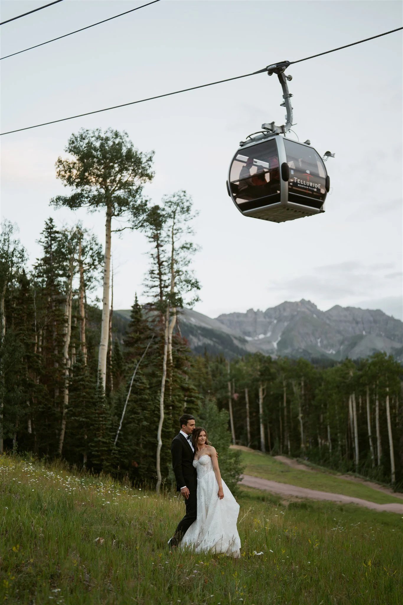 bride and groom with the gondola overhead
