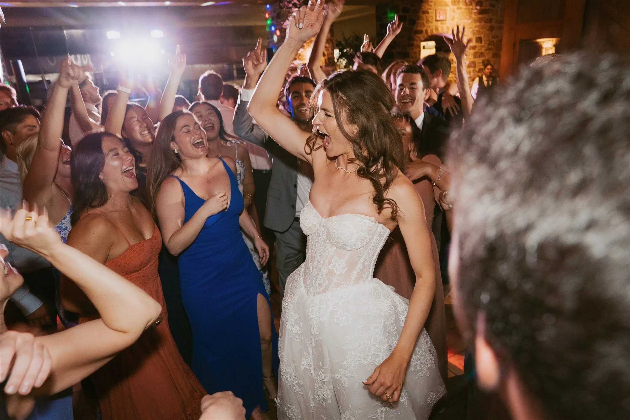 bride dancing surrounded by her guests