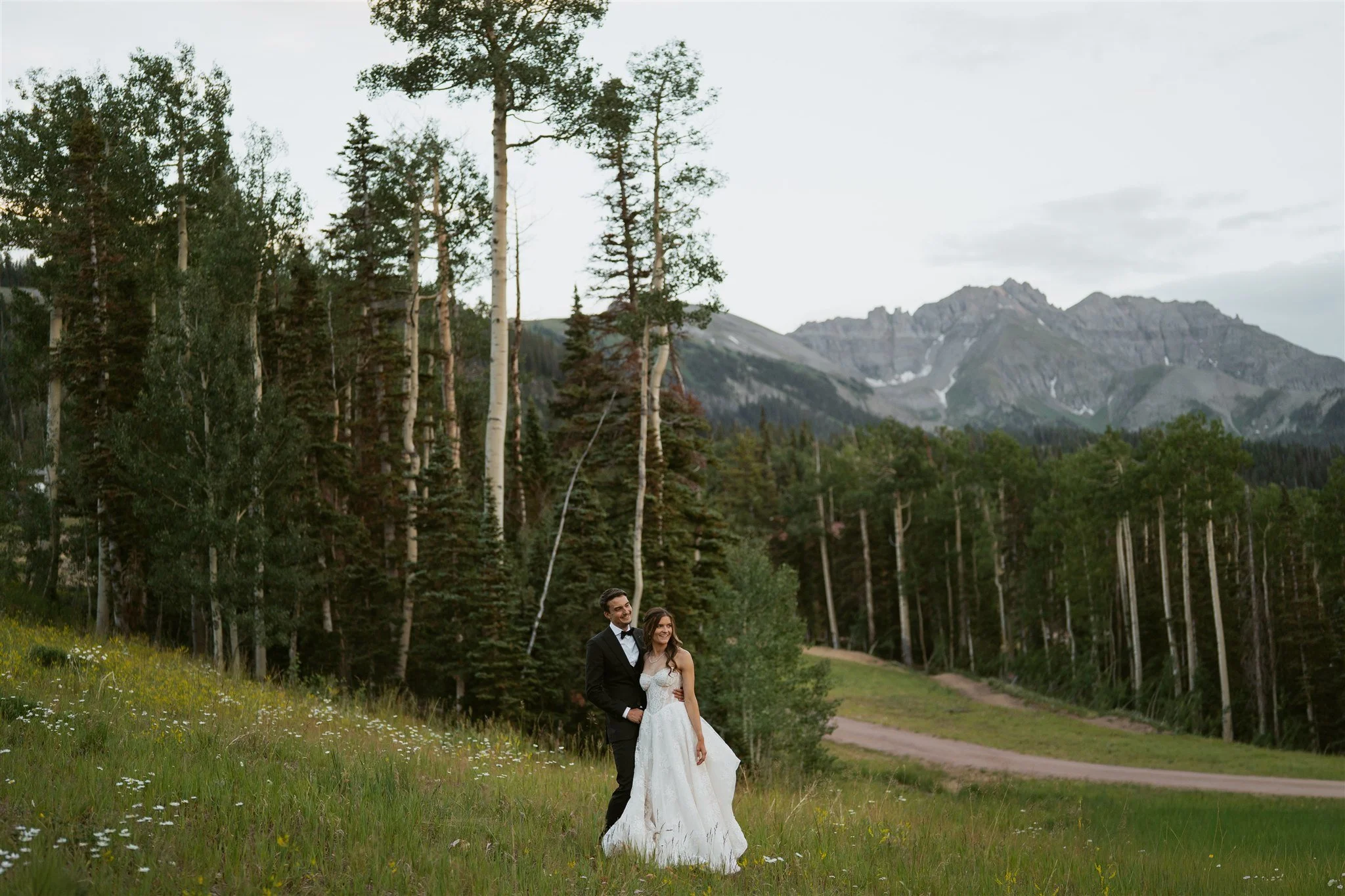 bride and groom enjoying the view of the mountains