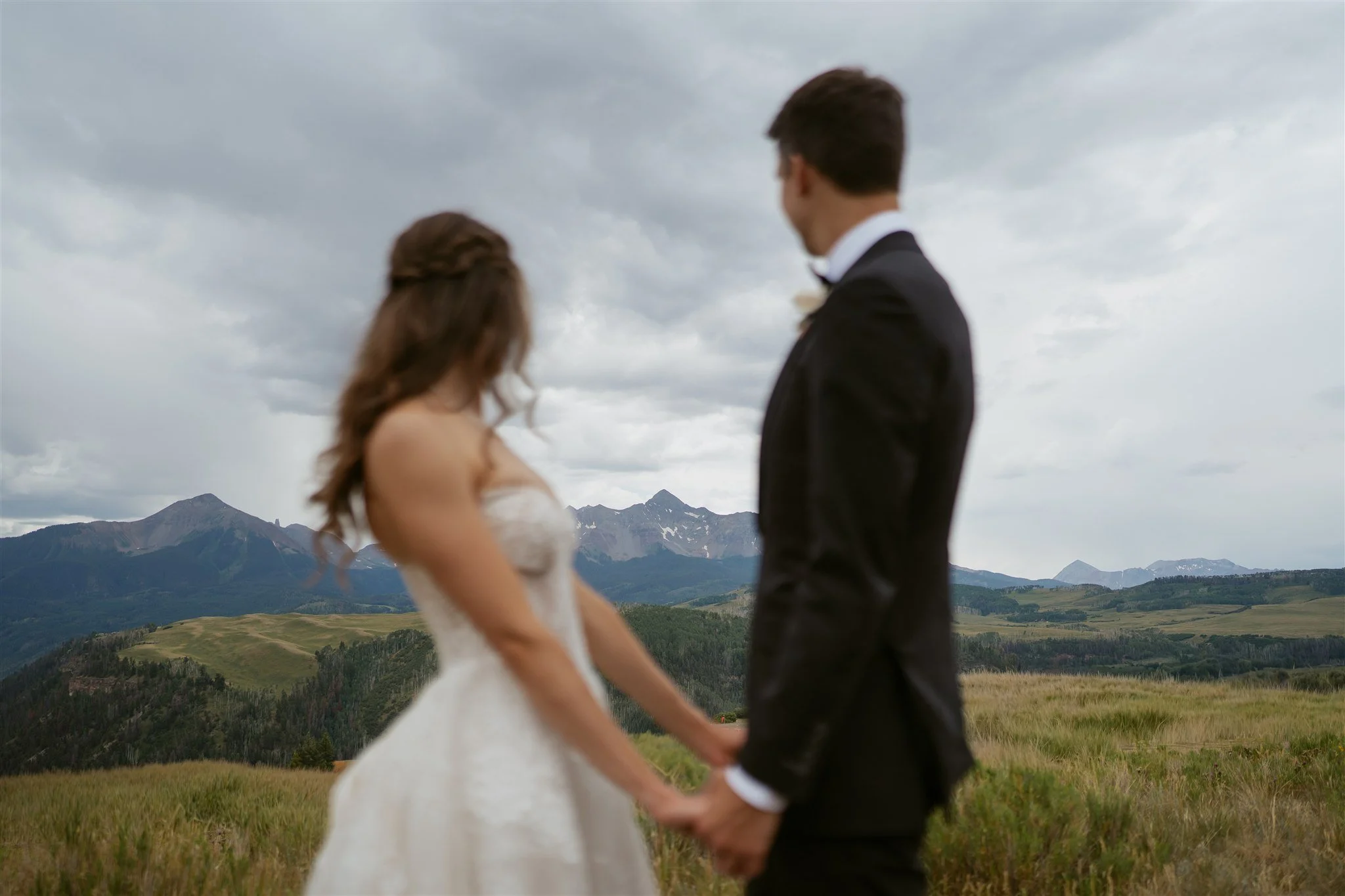 Bride and groom admiring Wilson Peak