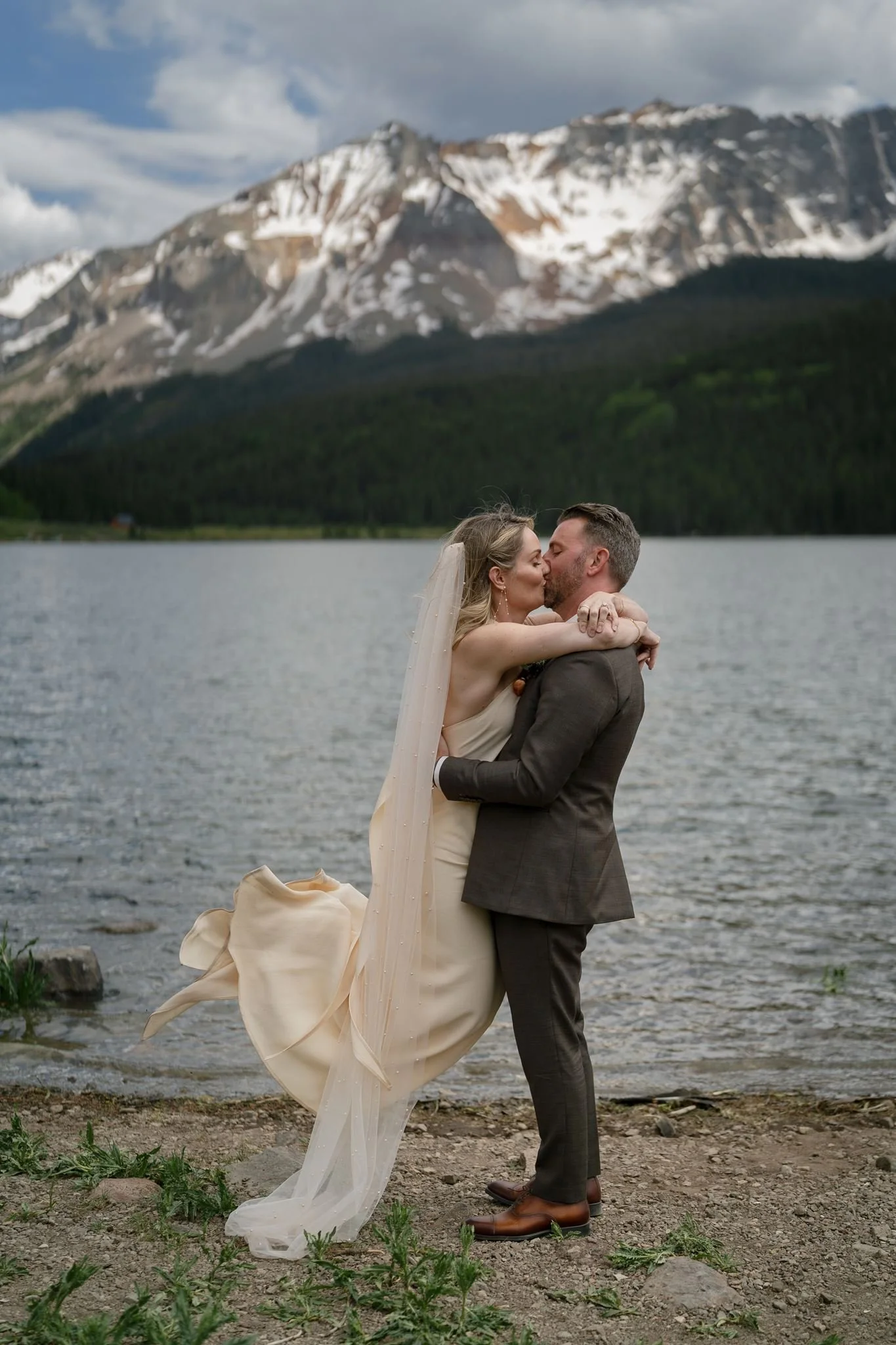 first kiss in front of the mountains