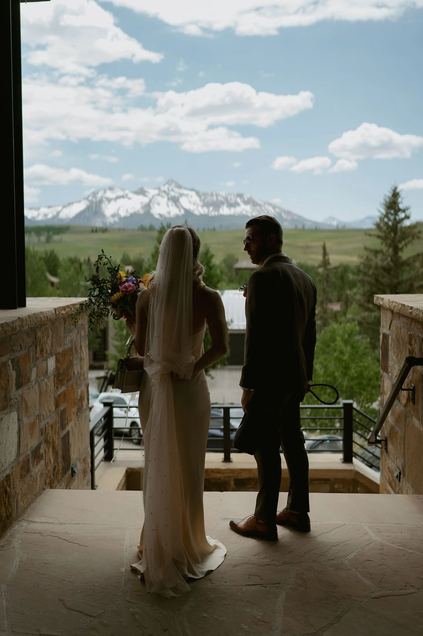 bride and groom exit the Airbnb en route to their ceremony