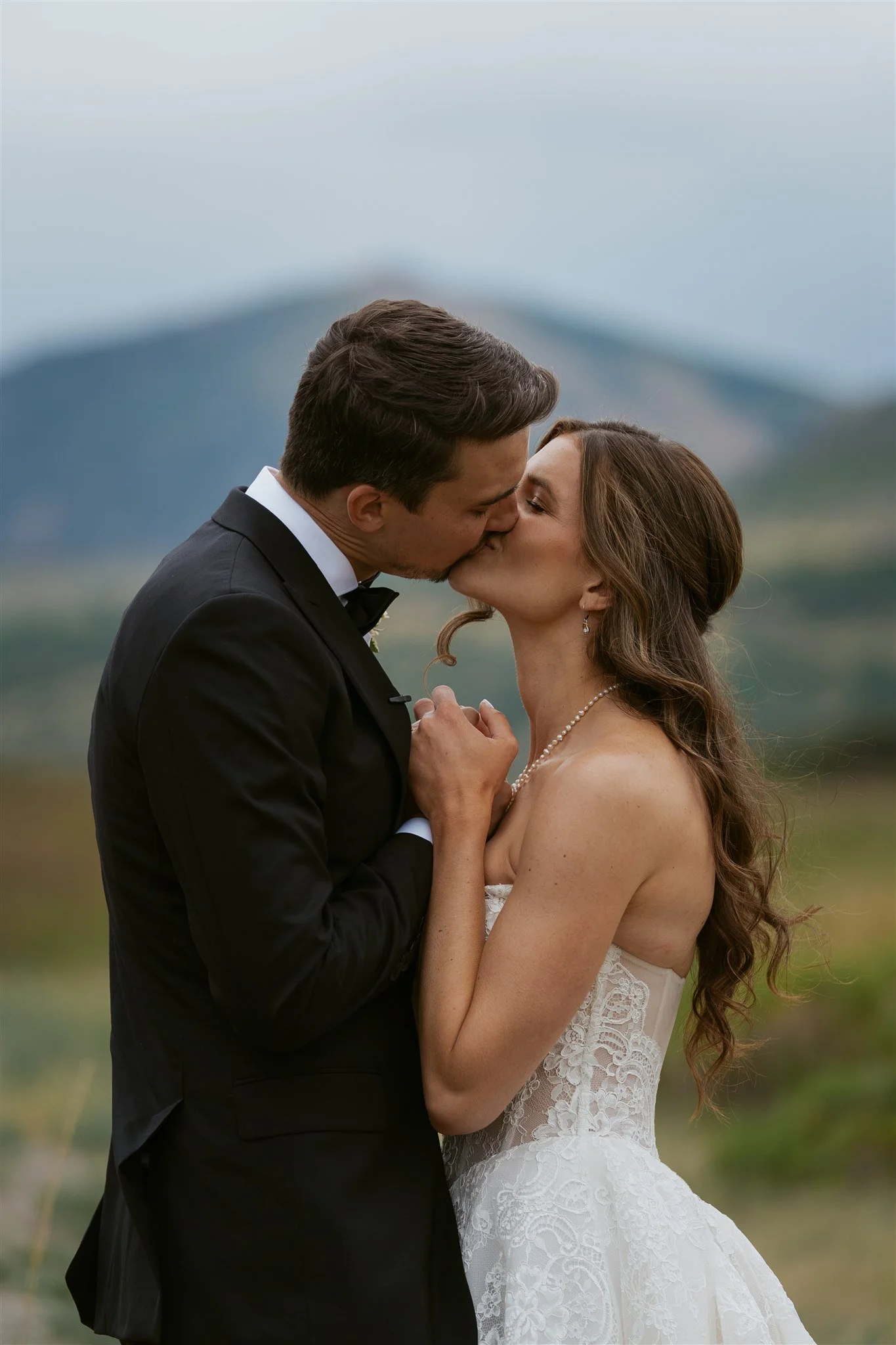 bride and groom share a kiss after their first look