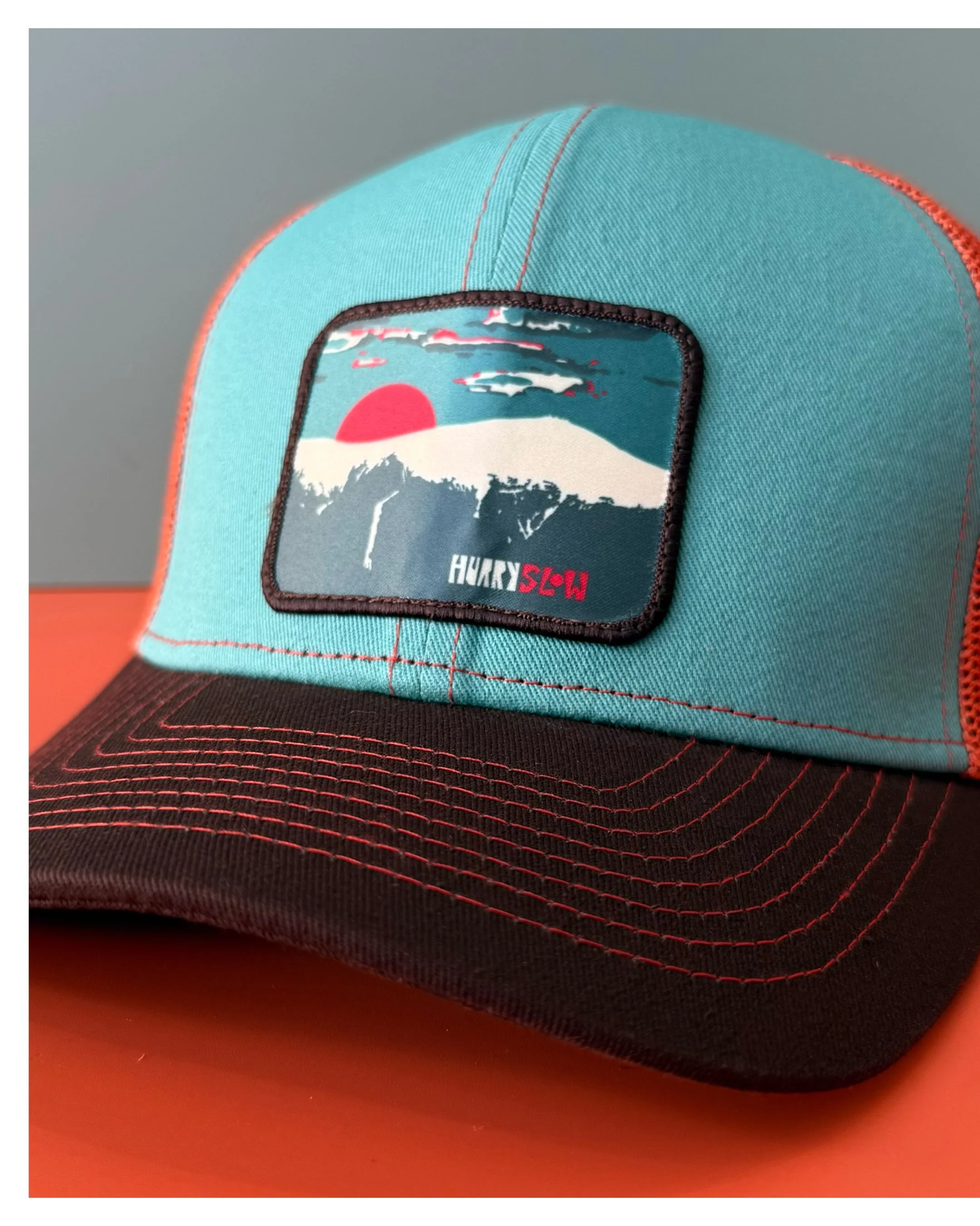 The &ldquo;Rockpile&rdquo; patch that you all know &amp; love is now available in new colors 🧢 These hats are on shelves in our store @ 1 Main Street in Littleton, NH, as well as on our website! 🤳🏽💻 🔗 hurryslowhat.co
