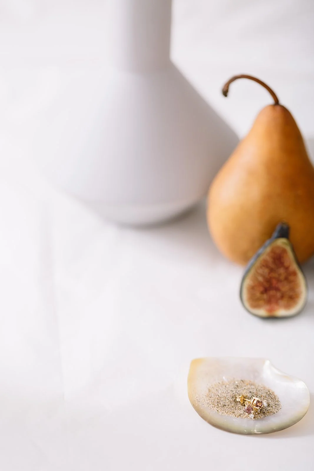Gold jewelry styled with fruit - Montreal product photography
