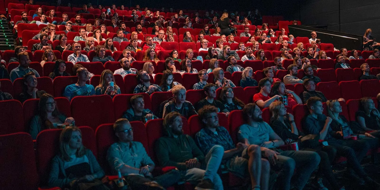 https://images.squarespace-cdn.com/content/v1/652614420877815fd80f9b4d/1697095332276-HLPFM8JBT9XHOHBLBLC5/Audience%2Bwatching%2Ba%2Bfilm%2Bin%2Ba%2Bcinema.jpg