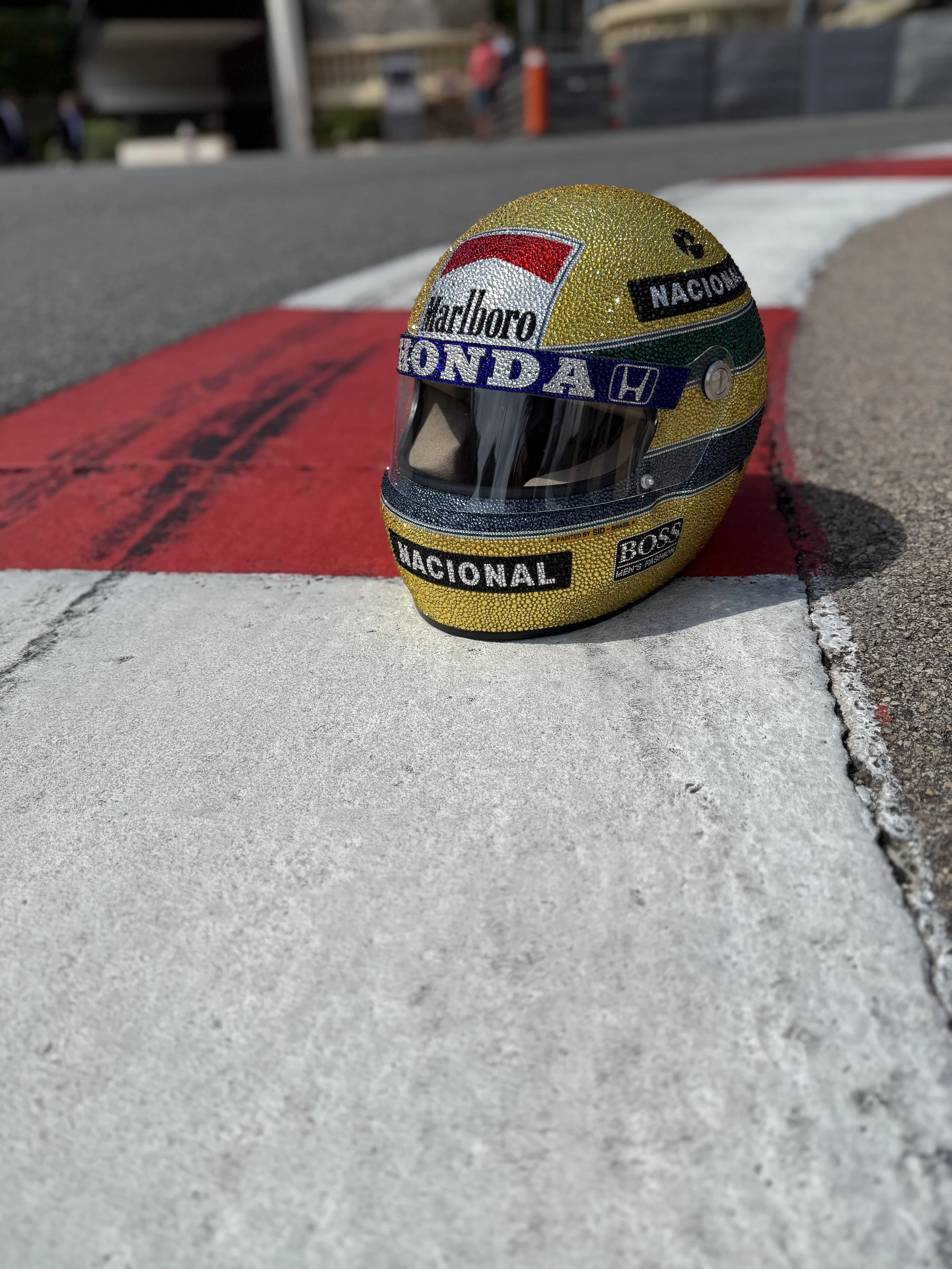 The Ayrton Senna Monaco 88 Crystal helmet on the Mirabeau hairpin on the Monte Carlo Circuit in 2025.