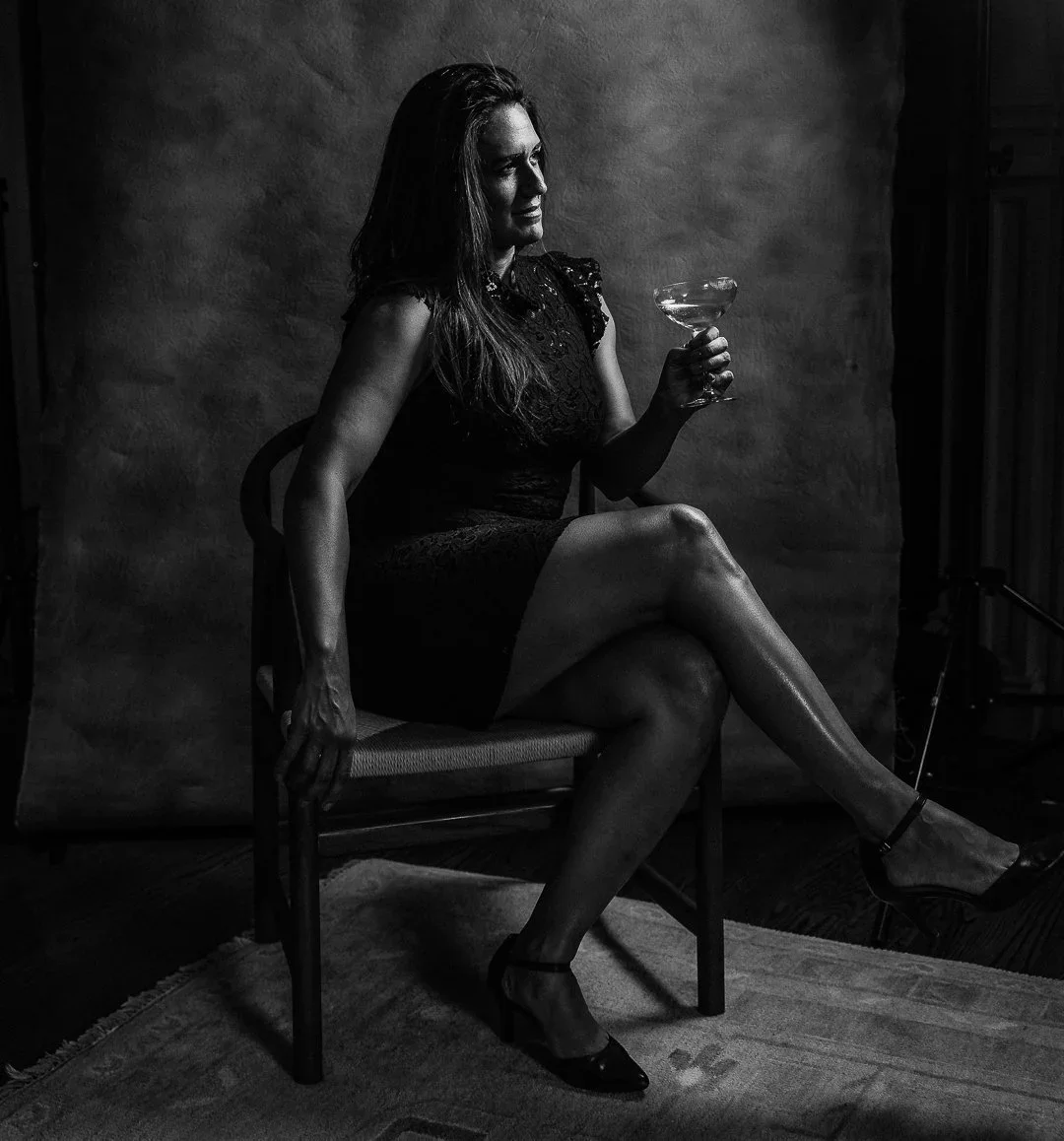 sophisticated-portrait-woman-black-dress-cocktail.webp