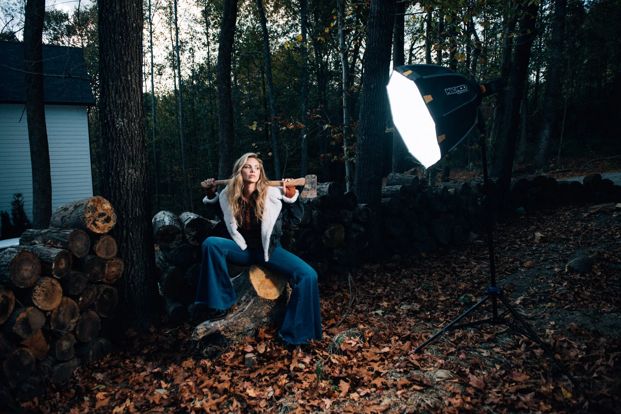 Behind the scenes of an outdoor portrait session blending strobe and natural light in a wooded setting, from a Nashville photography workshop