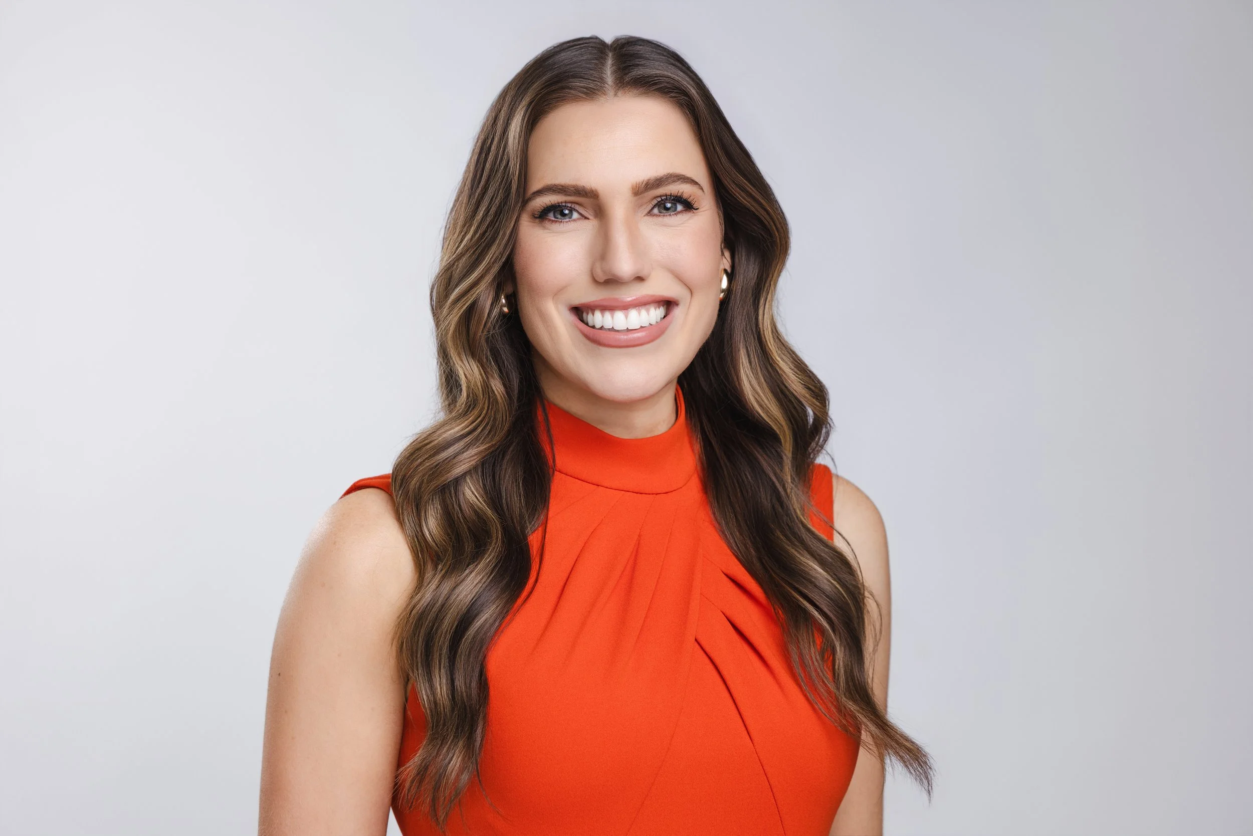 Professional headshot of a female WSMV news anchor in a studio setting, photographed by Tausha Dickinson.