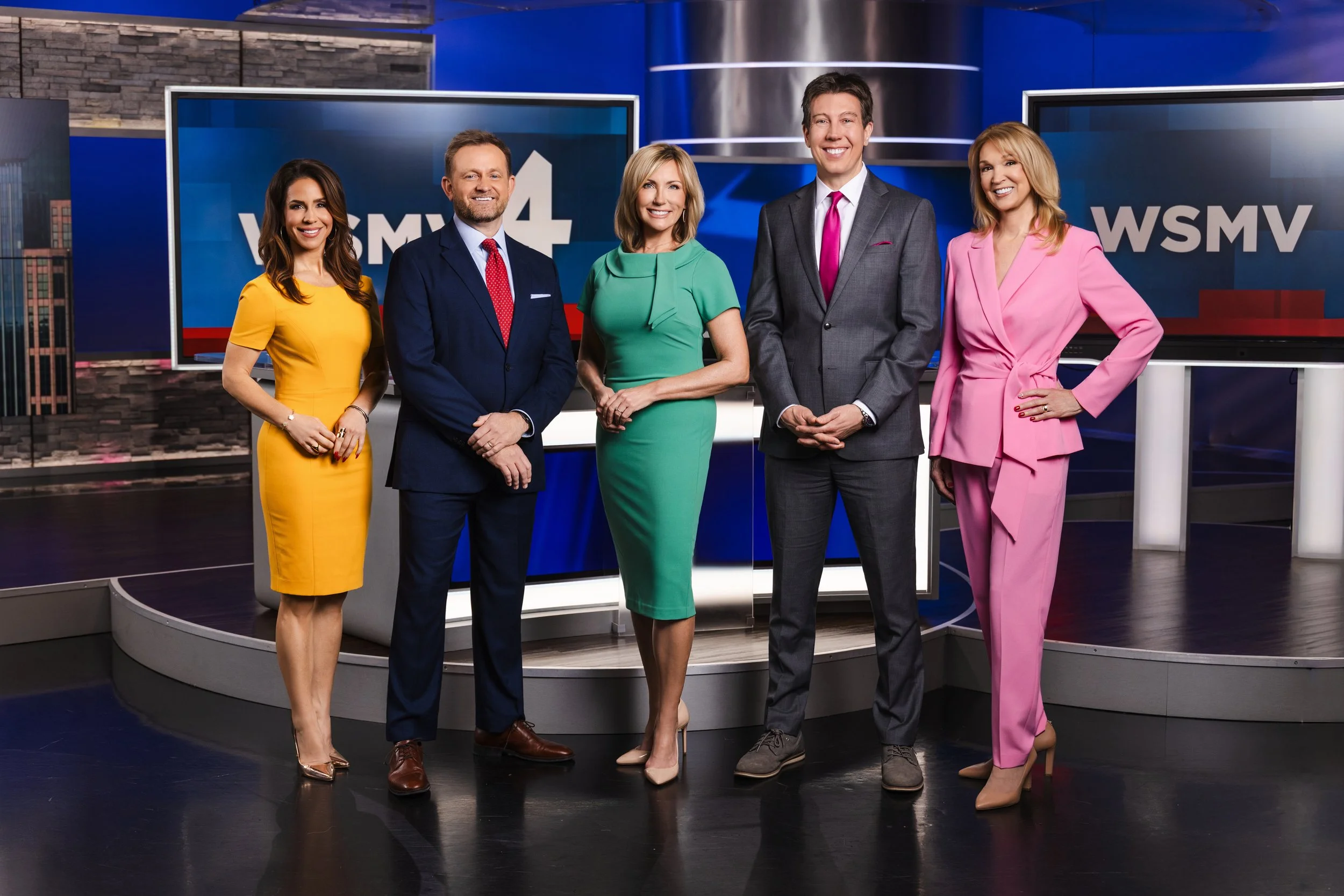 Group portrait of the WSMV news anchor team standing inside the Nashville television studio, photographed by Tausha Dickinson.