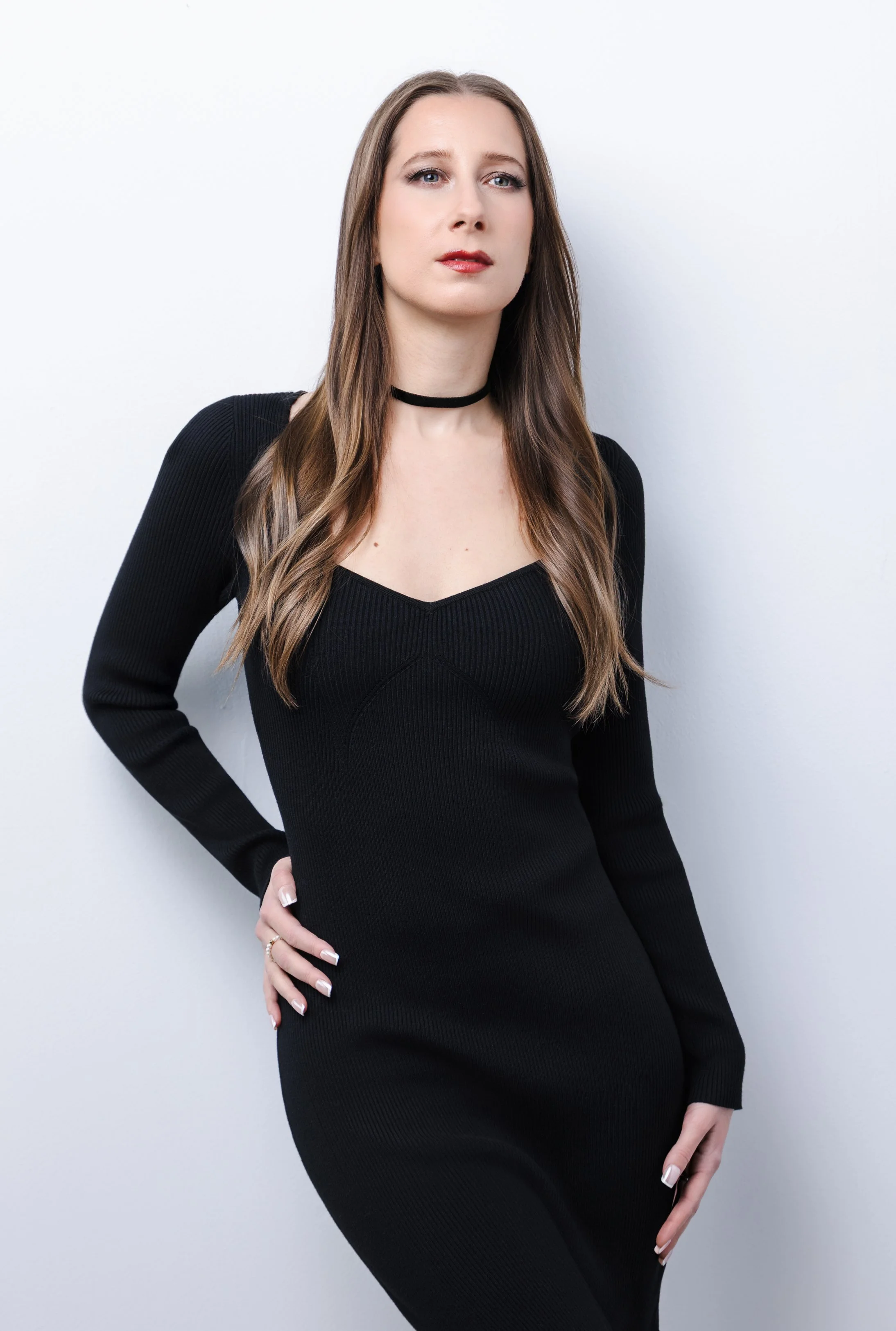 Clean, bright studio portrait of Nashville singer-songwriter Lauren River against a white backdrop using one-light studio lighting.