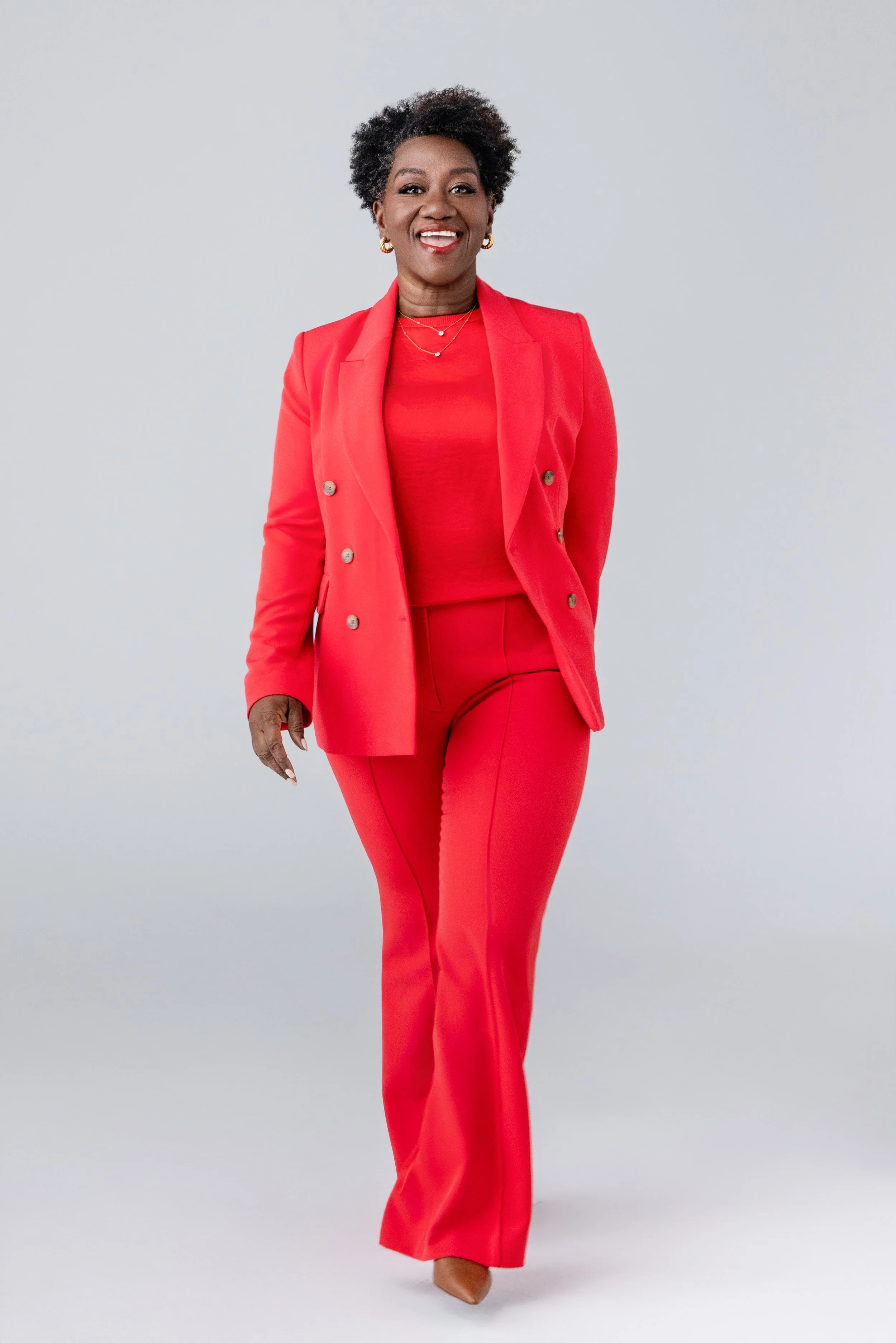 This full-body branding image of Tressie McMillan Cottom in motion radiates momentum and focus. A clean, minimalist setup captured by a Nashville Commercial Photographer, perfect for thought leaders and speaker branding.