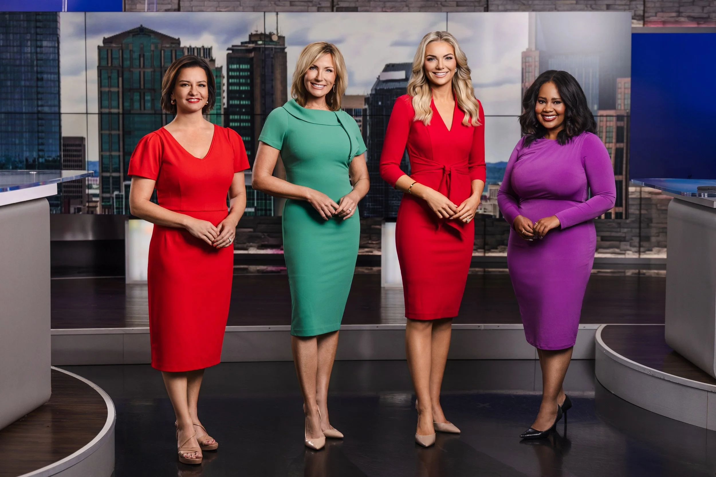 Portrait of the WSMV 4 news team gathered at the anchor desk inside the Nashville studio, photographed by Tausha Dickinson.