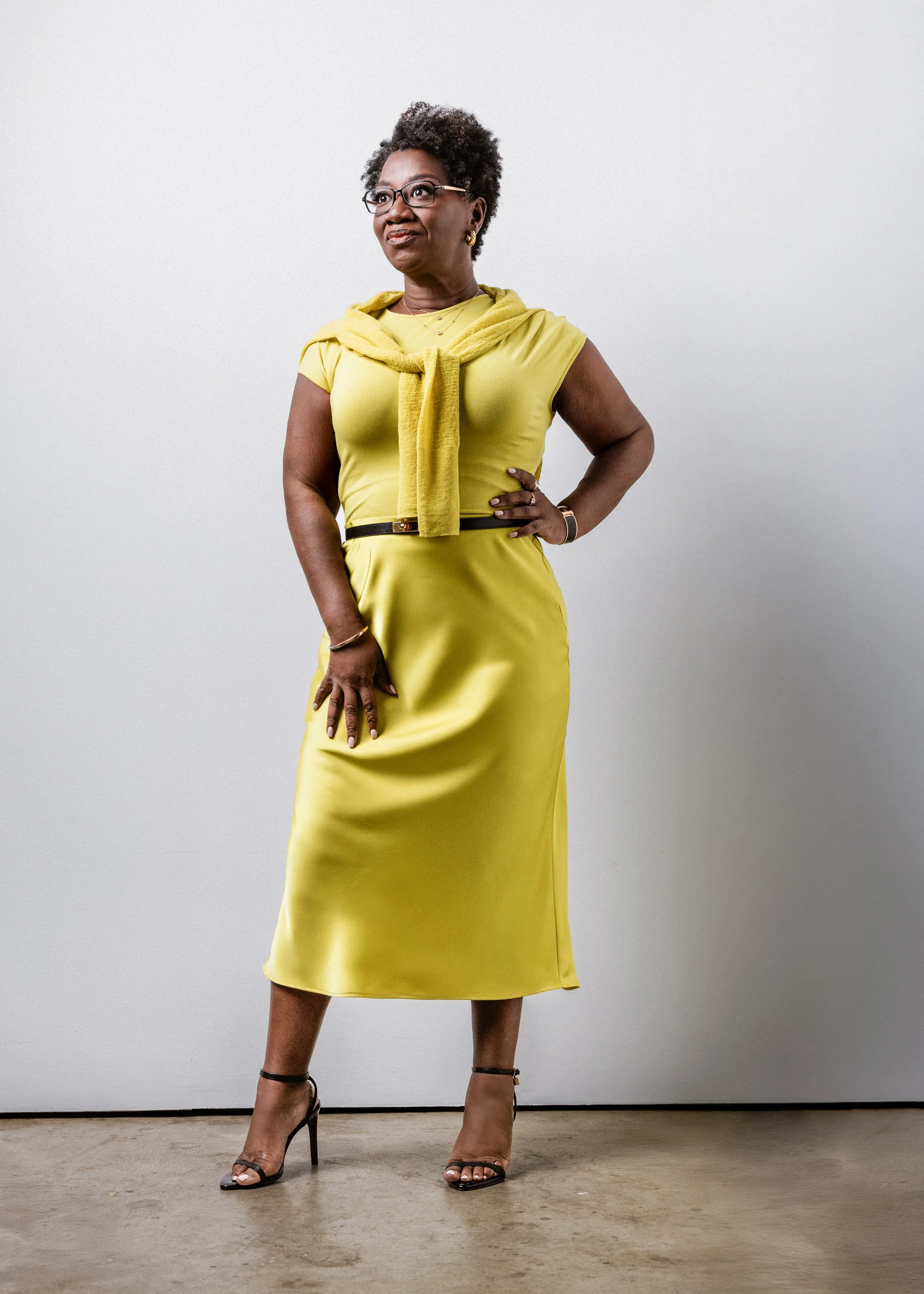 Set against a white wall with natural light, this striking portrait features bold color, confidence, and poise. A standout branding photo crafted for modern visibility by a Nashville Commercial Photographer.